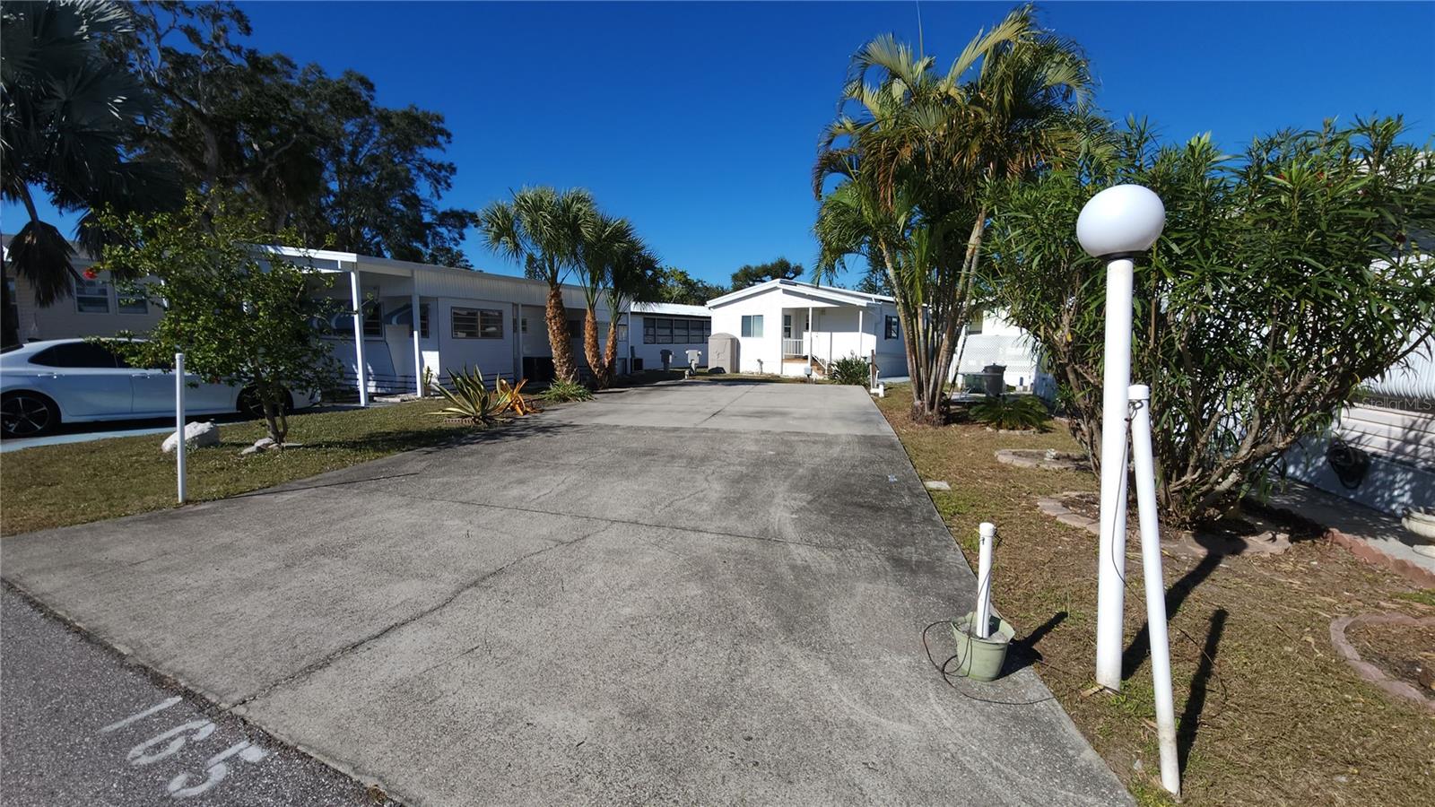 PAVED LOT IN ACTIVE 55+ COMMUNITY! Property could have a mobile home set on it, or be used as an RV lot. Lot could also be rented out for up to six months per calendar year for RV's. New electrical and cable hookups. SUGAR CREEK ESTATES HAS QUARTERLY HOA FEES OF $550 which include water, sewer, cable, internet & grass mowing.  The community has a clubhouse, pool, shuffleboard, and laundry facilities. Sold for CASH ONLY. A minimum 750 credit score is required to purchase in this community. Property is near the Braden River and River Links Golf Course. Sorry, this is not a dog lot.