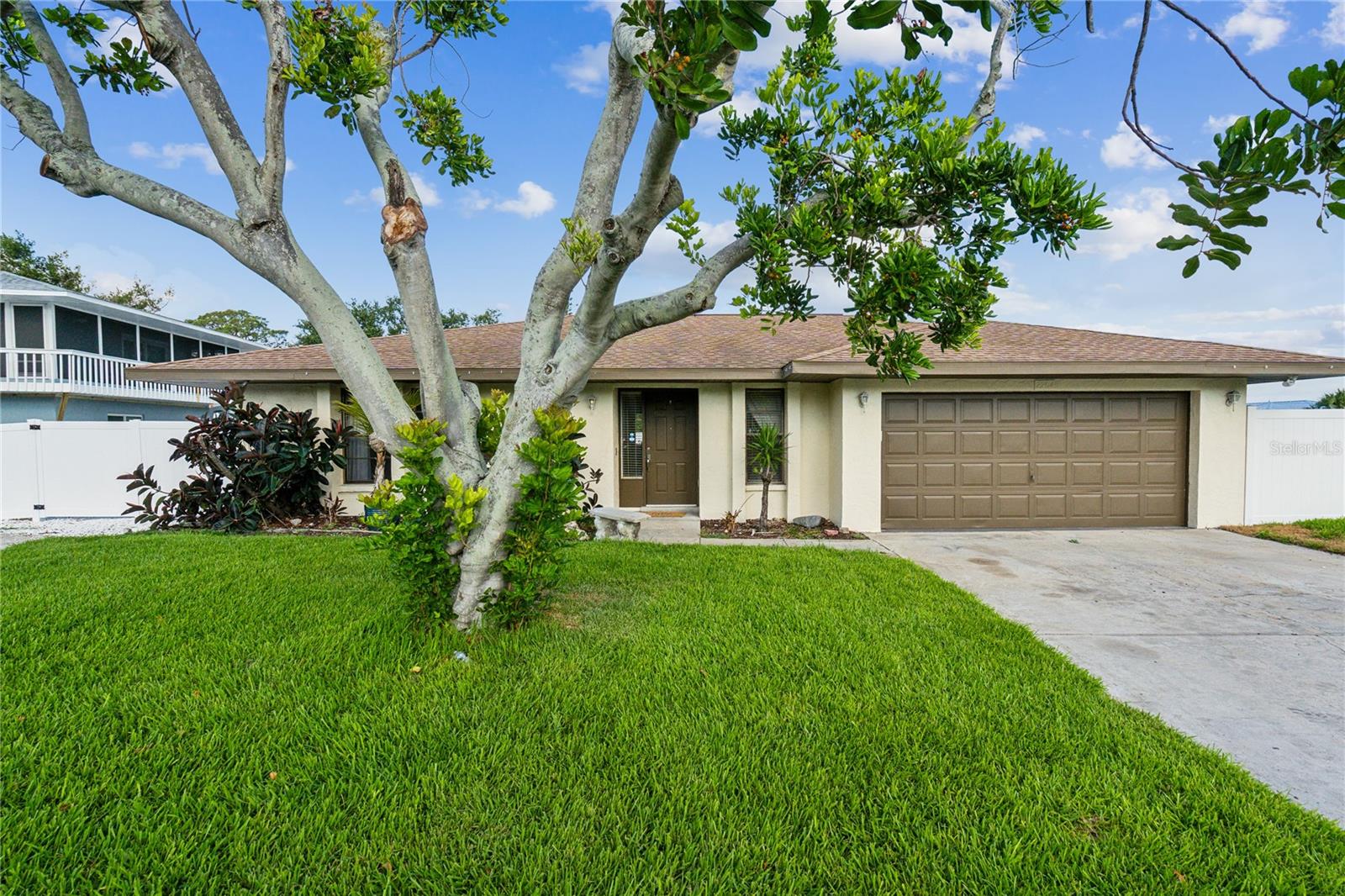 Welcome to 2204 78th St. W, Bradenton, a spacious 2 bedroom, 2 bathroom corner-lot home offering freedom, space, and endless options. With no HOA restrictions, bring your boat, RV, or extra vehicles and enjoy a private parking pad behind the new vinyl fence. Updates include new vinyl flooring, fresh paint, fencing, and new sod in the backyard. The oversized backyard is a rare find perfect for a pool, garden, or custom outdoor retreat. Ideally located near shopping, dining, schools, and just 10 minutes from the Gulf beaches.