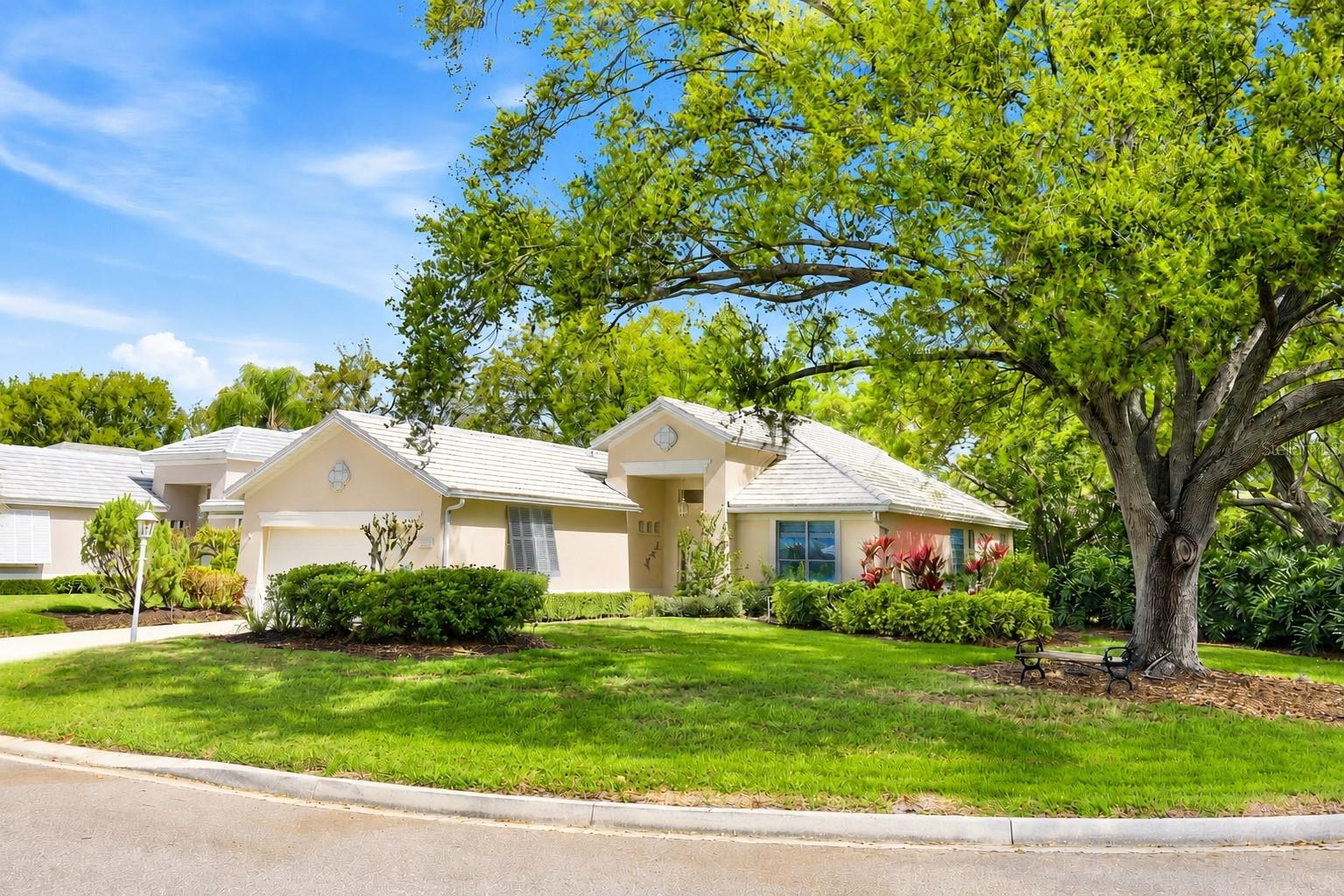 ROOF 2022 & AC 2020, UPDATED KITCHEN. Move-in ready and meticulously maintained, with recent updates and refreshing improvements throughout. Nothing left to do but unpack, relax, and enjoy the Florida lifestyle.
Step inside and discover a beautifully renovated, light-filled residence designed for both comfort and elegant everyday living. From the moment you enter, the welcoming foyer opens to an expansive living room with soaring ceilings and serene views of the lush backyard, where vibrant flowers bloom year-round and the gentle sounds of nature create a peaceful, private retreat.
The generous living area offers ample space for your most cherished furnishings while providing the perfect backdrop to display fine art or treasured family pieces. Adjacent to the living space, the elegant dining area is ideal for hosting intimate gatherings and memorable dinners with friends and loved ones.
The updated kitchen, renovated in 2022, features modern appliances, abundant cabinetry, and a cozy dinette—perfect for relaxed morning coffee or casual meals while enjoying views of the surrounding greenery.
A charming sunroom offers a versatile space that can easily become a favorite retreat—ideal for reading, relaxing, or creating a bright second office tailored to your lifestyle. At the front of the home, a separate office provides additional flexibility and may serve as a guest bedroom, art studio, or hobby room.
The spacious primary suite is a true private sanctuary, offering tranquil garden views, a generous walk-in closet, and a well-appointed bathroom with whirlpool tub, walk-in shower, and oversized vanity with abundant storage.
Situated on a desirable corner lot, the home enjoys added privacy, beautiful natural light from multiple directions, and enhanced curb appeal with greater street presence. Best of all, you can enjoy the benefits of resort-style living without the responsibility of pool maintenance, as the community pool is just a short walk away—perfect for relaxing beside the sparkling water or enjoying Florida’s sunshine.
This impeccably maintained home is truly move-in ready, offering peace of mind with major recent updates and the opportunity to enjoy a relaxed, refined Florida lifestyle.Location – University Park Country Club
Renowned for its mature landscaping and natural beauty, University Park Country Club is one of Sarasota’s most respected and well-knowing master-planned communities. Behind the secured, staffed gates lies an award-winning, resident-owned community featuring 27 holes of four-star rated championship golf, eleven lighted Har-Tru tennis courts, pickleball, a state-of-the-art fitness center, croquet, and miles of scenic tree-lined streets ideal for walking or biking.
Residents enjoy an active social lifestyle with exceptional dining, vibrant clubs, and a wide variety of community events.
Ideally located just minutes from UTC’s luxury shopping and dining, and only a short drive to downtown Sarasota’s renowned arts district, museums, theaters, and waterfront, the community also offers convenient access to Sarasota-Bradenton International Airport and the world-famous beaches of Florida’s Gulf Coast.
University Park Country Club offers a rare opportunity to enjoy refined living in one of Sarasota’s most sought-after communities.