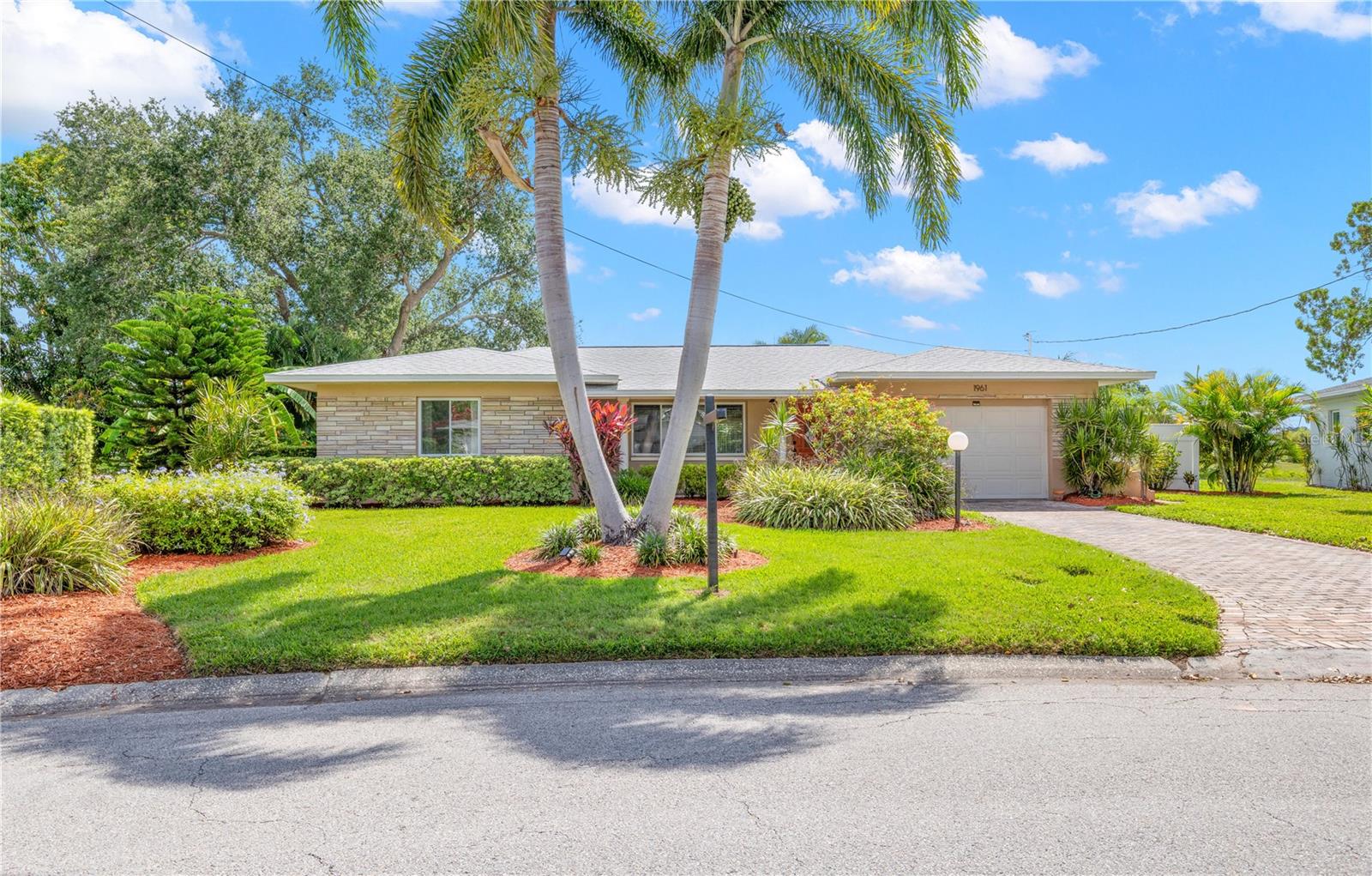 Rare lakefront opportunity in the heart of St. Petersburg! Situated on the peaceful shores of Harshaw Lake, this beautifully updated 2-bedroom, 2-bath home offers stunning water views and the Florida lifestyle buyers dream about. Enjoy morning coffee by the lake, breathtaking sunrises, and relaxing evenings from your own private waterfront retreat.

Inside, you'll find a bright, open layout featuring an updated kitchen with stone countertops, quality cabinetry, stainless steel appliances, and ample storage. Both bathrooms have been tastefully renovated, and the spacious Florida room offers flexible space for a home office, guest room, media room, or potential third bedroom.

Major updates include a newer roof, HVAC system, ductwork, energy-efficient insulation, and updated plumbing. Outside, the screened lanai and expansive outdoor living area provide the perfect setting for entertaining or simply enjoying the serene lake views. Conveniently located just minutes from downtown St. Petersburg, shopping, dining, and award-winning beaches, this move-in-ready waterfront gem is a rare find