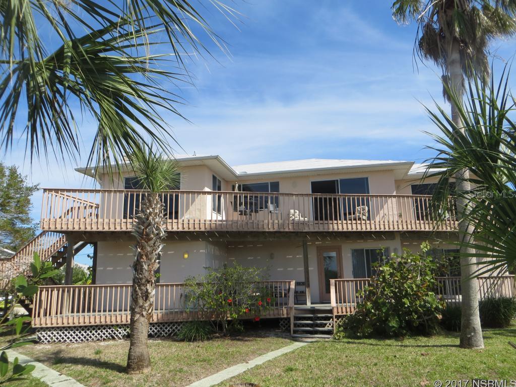 Direct riverfront home on the Indian River with pristine views west, north and south! Panoramic. Enjoy sunsets, fishing, boating. Watch dolphins swimming by as well as the manatees!  Boat dock with lift, water and electricity. Heated screened in swimming pool. Large spacious master bedroom with private bath. Downstairs has a small family room. Plenty of decks. Short walk to the beach and public park with tennis court, basketball and children's playground. Close to Canaveral Seashore. Peaceful and serene setting. ;Water: City