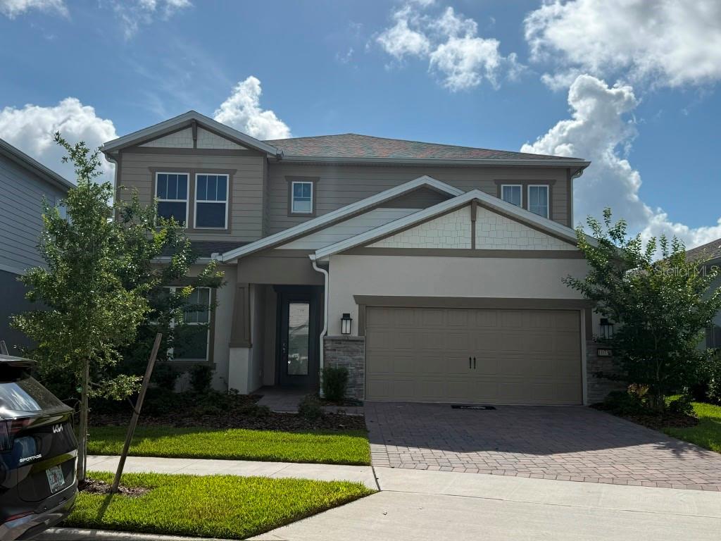 Welcome to this exceptional former model home in the highly sought-after Isles of Lake Nona community. Completed and released for sale in March 2025, this professionally designed showcase residence offers 5 bedrooms, 4 full bathrooms, 1 half bathroom, and 3,416 square feet of luxurious living space.

Thoughtfully appointed with numerous builder upgrades, the home features a stunning built-in gourmet kitchen with elegant cappuccino cabinetry, quartz countertops, premium finishes, and an open-concept design that seamlessly connects the kitchen, dining, and living areas—perfect for everyday living and entertaining. Every detail reflects the quality and craftsmanship expected from a model home.

The spacious primary suite provides a private retreat, while the additional bedrooms and bathrooms offer comfort and flexibility for family members and guests. Natural light fills the home, creating a warm and inviting atmosphere throughout.

Step outside to your beautiful outdoor living space, where you can relax and enjoy tranquil water views. The backyard has been enhanced with a private putting green, creating the perfect setting for recreation, entertaining, or simply enjoying Florida’s year-round lifestyle.

Residents of Isles of Lake Nona enjoy access to outstanding resort-style amenities, including a spectacular community pool, splash pad, fitness center, event room, two pickleball courts, two tennis courts, scenic walking areas surrounding five ponds, on-site management, on-site facilities support, and two gated entrances.

Ideally located near Medical City, top-rated schools, shopping, dining, and major highways, this home is approximately 15 minutes from the new Nona West Mall and entertainment district and only 20 minutes from Orlando International Airport.

This is a rare opportunity to own a professionally decorated former model home with premium upgrades, water views, and exceptional community amenities in one of Central Florida’s most desirable neighborhoods.