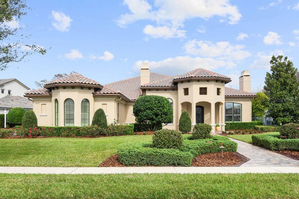 Charming Single-Story Home in Sought After Waterstone Community

Welcome to this exquisite residence just under 5000 sq ft, nestled in the serene guard-gated community of Waterstone, boasting a breathtaking conservation area view. This one-story gem, situated on an oversized lot, offers an unparalleled living experience with private access to the esteemed Windermere Preparatory School.

Key Features:

Stunning Views and Location: Enjoy the tranquility of a conservation area right from your backyard, offering a peaceful retreat from the bustling city life.

Spacious and Elegant Design: This home featuring 4 fireplaces, has a thoughtful layout with spacious rooms, designed for comfort and luxury. The single-story design ensures easy accessibility and a seamless flow throughout the home.

Entertainer's Dream: The heart of this home is the open-plan living, dining, and kitchen area. It's a perfect space for hosting gatherings, with ample room for guests to mingle comfortably.

Gourmet Kitchen: A chef's delight, the kitchen is equipped with high-end appliances, beautiful countertops, and a large island. The hidden walk-in pantry provides abundant storage while keeping your kitchen clutter-free.

Luxurious Master Suite: The master bedroom is a private sanctuary with a separate sitting area, ideal for relaxation. It's a perfect space to unwind after a long day.

Enclosed Lanai: The air-conditioned lanai offers additional living space, perfect for enjoying the Florida weather year-round without the discomfort of extreme temperatures.

Saltwater Pool: Dive into your own private saltwater pool, a centerpiece for outdoor entertainment and relaxation.

Exclusive Community Amenities: Living in Waterstone means access to top-tier amenities, including 24-hour security, beautifully maintained grounds, and private pathways to Windermere Prep.

This home is more than just a residence; it's a lifestyle choice for those seeking luxury, privacy, and convenience in one of the most sought-after communities in the area. Don't miss the opportunity to own this magnificent home in Waterstone.