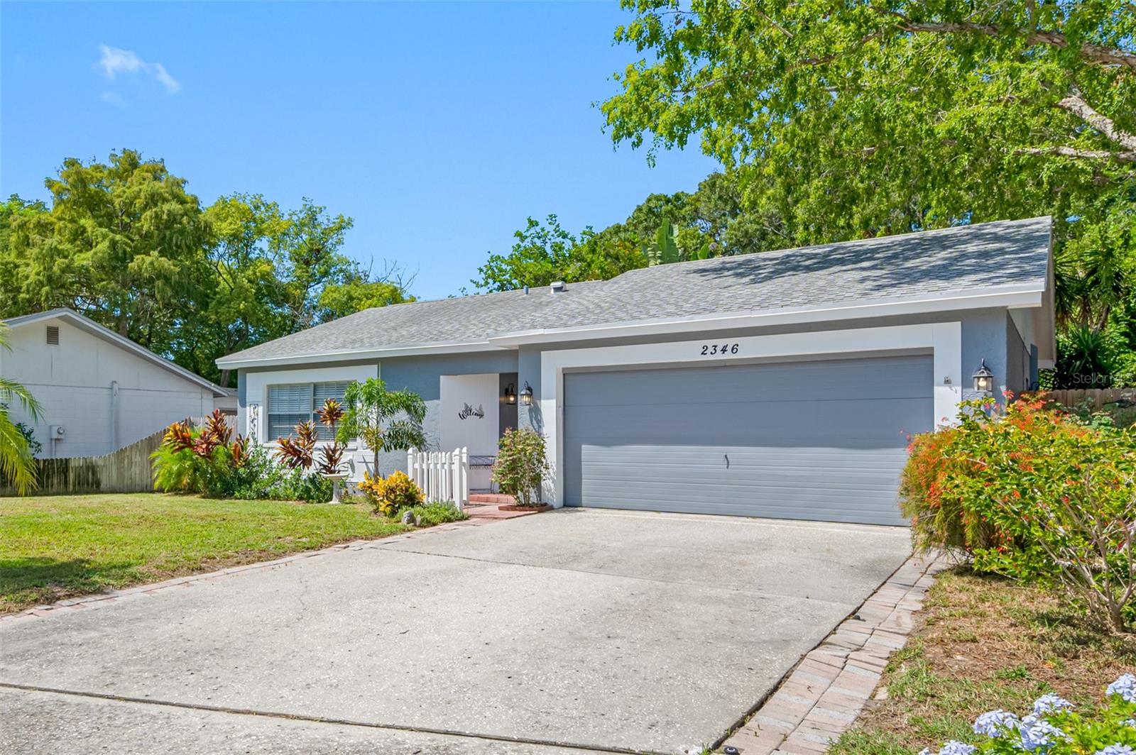 Welcome to a move-in-ready delightful 2-bedroom, 2-bathroom, pool home nestled in the highly sought-after Beacon Groves neighborhood in beautiful Palm Harbor. This property offers a perfect blend of comfort, style, and functionality, making it an ideal place to call home.
As you step inside, you'll immediately notice the warmth of the living space which is currently set up as a dining room. The family room is highlighted by a cozy wood burning fireplace and French doors that leads you to the patio. The open floor plan seamlessly connects the living room, dinette area, and kitchen, creating an inviting atmosphere for family gatherings and entertaining guests.
The kitchen includes wood cabinets, granite counter tops, a new microwave and dishwasher, making meal prep and clean-up a breeze. The French doors from the dining area opens to a spacious covered porch, perfect for al fresco dining or relaxing with a morning cup of coffee.
One of the standout features of this property is the enclosed pool and pavered pool deck. Whether you're taking a refreshing dip on a hot Florida day or lounging poolside, you'll love spending time in this private oasis. The brand-new panel for pool equipment ensures hassle-free maintenance, and the new Rainbird irrigation controller keeps the landscaping looking its best year-round.
With a two-car garage and a big backyard, this home offers ample space for storage and outdoor activities. The new HVAC system installed in 2022 ensures year-round comfort and energy efficiency.  
This neighborhood is zoned for excellent Palm Harbor schools, and it is in a non-evacuation zone. Palm Harbor's convenient location provides easy access to beaches, parks, shopping, and dining, offering the quintessential Florida lifestyle.
Don't miss the opportunity to make 2346 Orangeside Road your new home.