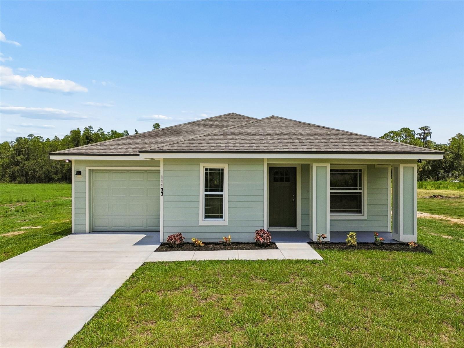 Welcome to your dream home! This brand-new 3-bedroom, 2-bath residence is perfectly situated on over 2 acres, offering the ideal combination of modern comfort and peaceful country living-with NO HOA! Step inside to an open-concept floor plan featuring soaring vaulted ceilings, luxury vinyl plank flooring, and abundant natural light throughout. The stylish kitchen is designed to impress with granite countertops, stainless steel appliances, ample cabinetry, and spacious pantry storage. The private primary suite offers a tray ceiling, walk-in closet, and beautifully appointed en-suite bath with dual vanities. The 1-car garage includes washer and dryer hookups and provides ample space for storage or parking. Enjoy the freedom of over 2 acres with endless possibilities for gardening, recreational vehicles, animals, or future additions. Conveniently located just minutes from shopping, dining and major roadways while still offering the privacy and tranquility of country living. Don't miss this incredible opportunity-schedule your private showing today!