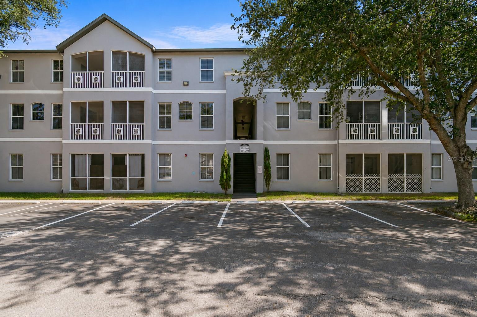 Virtually Staged. Nearly 1,500 SF! Two Primary Suites • Two Screened Balconies!  Welcome home to one of the largest and most desirable floor plans in Sunridge Palms! Offering nearly 1,500 square feet of thoughtfully designed living space, this beautifully updated two-bedroom, two-and-a-half-bath condominium combines spacious living, modern updates, and an exceptional location in one of the area's most convenient communities.

From the moment you step inside, you'll appreciate the dramatic vaulted ceilings, abundant natural light, and open-concept design that creates an inviting place to relax or entertain. The spacious living and dining areas flow effortlessly into the remodeled kitchen featuring brand-new stainless-steel appliances, abundant cabinetry, generous counter space, pantry storage, breakfast bar seating, and two built-in workstations—ideal for today's work-from-home lifestyle, hobbies, or managing everyday life.

The main living area features durable ceramic tile flooring, a welcoming foyer, convenient powder bath, and access to a private screened balcony overlooking peaceful green space with no rear neighbors. It's the perfect spot to enjoy your morning coffee or unwind with a glass of wine at the end of the day.

Upstairs, you'll discover two oversized primary bedroom suites, each offering its own private bathroom and direct access to a second screened balcony. This unique layout provides exceptional privacy for family members, guests, or multi-generational living. New carpeting throughout the second floor, a full-size washer and dryer, generous closet space, and under-stair storage complete this highly functional floor plan.

Just a short 1/2 block walk to a beautifully maintained clubhouse, and sparkling swimming pool.

The location simply can't be beat. Situated directly across from the University of South Florida, you'll also be just minutes from Moffitt Cancer Center, AdventHealth, the James A. Haley VA Hospital, Busch Gardens, shopping, restaurants, and everyday conveniences. Easy access to Interstate 75 and Interstate 275 places Downtown Temple Terrace just minutes away, Downtown Tampa in approximately 15 to 20 minutes, and Tampa International Airport within about 20 to 25 minutes.

Whether you're searching for your first home, downsizing into a low-maintenance lifestyle, looking for a spacious home close to Tampa's world-class medical facilities, or simply wanting a move-in-ready residence in an outstanding location, this exceptional condominium offers the perfect combination of comfort, convenience, and value. Opportunities to own a home with this much space, privacy, and flexibility in such a prime Tampa location are becoming increasingly rare.