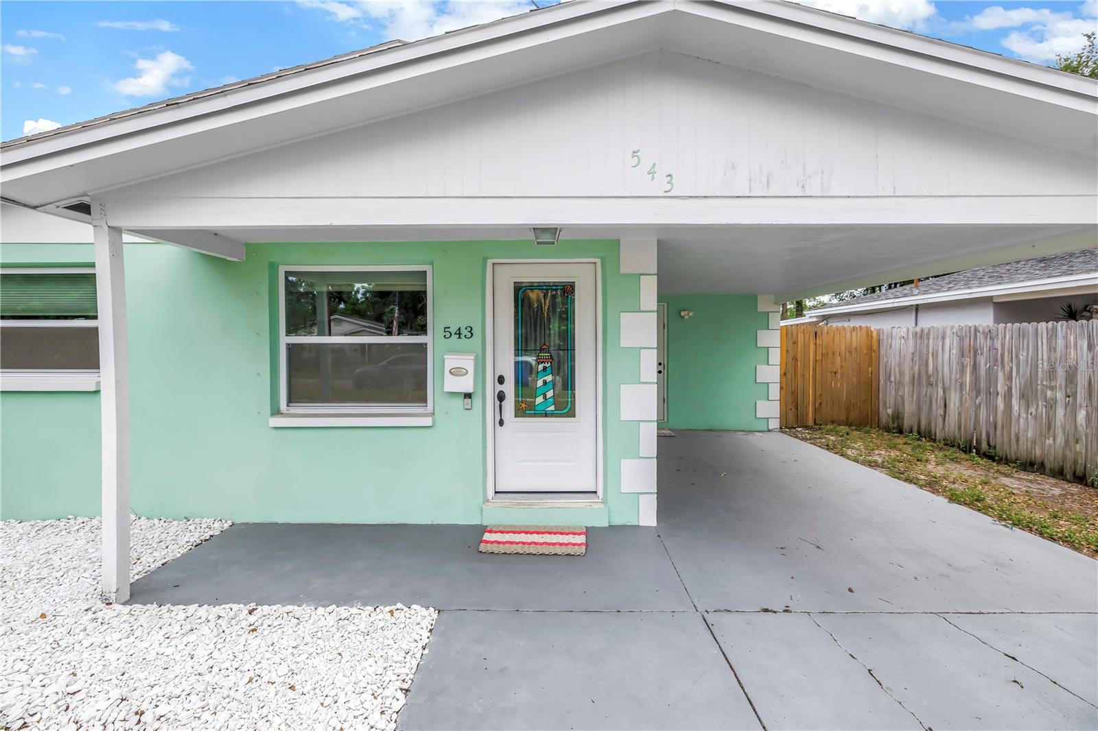 Welcome to this charming block ranch home offering comfort, efficiency, and a convenient location. Situated on a large private lot, this property features a newer fence, a spacious backyard, and a storage shed, providing plenty of room for outdoor living, gardening, or entertaining. Sliding glass doors open to the backyard and fill the bright Florida room/great room with natural light, creating the perfect space to relax or gather with family and friends. Inside, you'll find durable tile flooring throughout, recessed lighting, an updated bathroom, and a well-appointed kitchen with granite countertops. Solar panels help keep power bills low, adding to the home's affordability and efficiency. With no HOA restrictions and no history of flooding, this home offers peace of mind and flexibility. Conveniently located just minutes from downtown St. Petersburg, major interstates, restaurants, shopping, and entertainment, this property combines everyday convenience with the privacy and comfort you've been looking for.