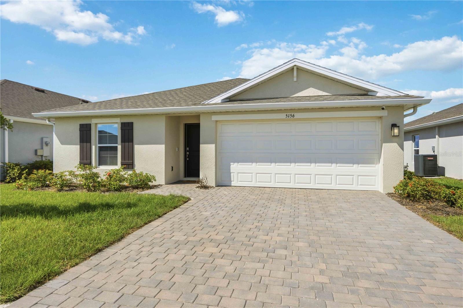 Offering 4 bedrooms, 2 bathrooms, and a 2-car garage, this thoughtfully designed single-story home features a desirable split-bedroom layout and an open-concept living space that is perfect for both everyday living and entertaining. The kitchen and bathrooms showcase elegant quartz countertops, while durable RevWood flooring adds style and functionality throughout the main living areas. Peaceful water views create the perfect backdrop for relaxing outdoors.

Since construction, the home has been enhanced with fresh interior paint, upgraded shower door, new vanity, and updated cabinetry hardware, adding a modern and polished touch throughout. Even better, the home still benefits from remaining builder warranties for added peace of mind.

Residents of Central Parc enjoy an impressive collection of amenities, including a resort-style pool, hot tub, tennis courts, pickleball courts, and scenic sidewalks throughout the community. Don't miss your opportunity to own a nearly new home with thoughtful upgrades already completed.