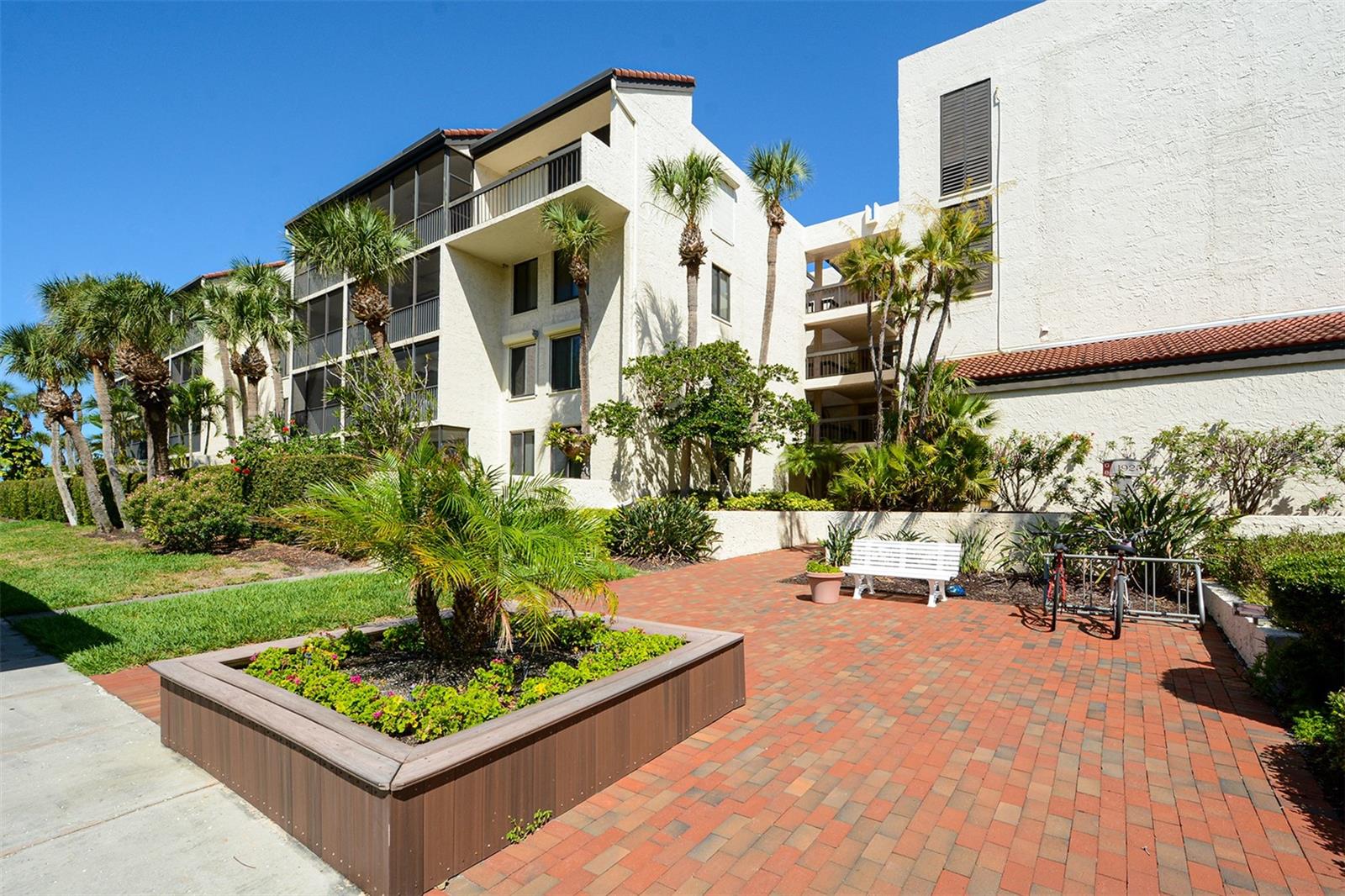 Experience the Best of Gulfside Living at Seaplace on Longboat Key!

Welcome to this beautifully maintained 2-bedroom, 2-bath residence offering the perfect blend of comfort, style, and coastal charm. This light-filled unit features an updated kitchen with rich wood cabinetry, granite countertops, and ample storage—ideal for both everyday living and entertaining.

The spacious primary suite offers a relaxing retreat with generous closet space and an en-suite bath, while the guest bedroom provides comfort and privacy for visitors. Both bathrooms are tastefully updated, and the open-concept living and dining areas flow seamlessly to the screened lanai.

Step outside to your private lanai with hurricane impact screening, where you can enjoy tranquil views and refreshing Gulf breezes. The home is further enhanced with hurricane-impact windows, providing peace of mind and energy efficiency.

Residents of Seaplace enjoy approximately ½ mile of pristine Gulf beach frontage and an exceptional array of amenities across 42 beautifully landscaped acres. Highlights include two heated swimming pools and spas, Har-Tru tennis courts, scenic walking trails, a fitness center, and a clubhouse with kitchen, library, and sauna. Additional features include a playground, grilling areas, on-site management, and a 24-hour staffed gatehouse.

Whether you're seeking a full-time residence, seasonal retreat, or investment opportunity, this property offers a low-maintenance island lifestyle in one of Longboat Key’s most desirable communities.

Enjoy breathtaking sunsets, beachside strolls, and resort-style living—schedule your private showing today!