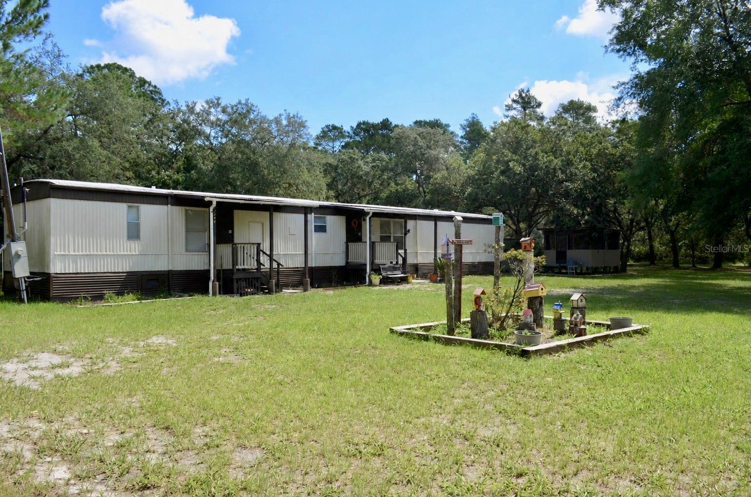 Welcome to the farm on over 4.5 beautiful Acres of land! 

Experience country living at its finest, with plenty of space for all your equipment and animals with no HOA restrictions. This beautiful, fully fenced horse property features a fire pit and a screened gazebo complete with an outdoor propane cooktop and sink. Additionally, there is an outside laundry room constructed of concrete that can double as a safe room. The location offers excellent privacy under a canopy of gorgeous live oak trees, backing up to many acres of a wooded forest preserve. It is also conveniently located close to the Saint Johns River for boating and just 15 minutes from DeLand. 

All information should be verified by buyer.