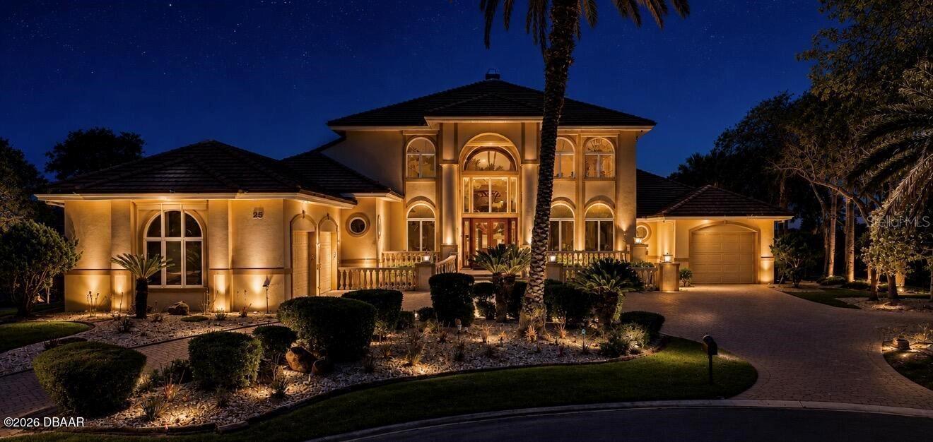 Virtually Staged. Privately positioned at the end of a quiet cul-de-sac in the gated, oceanfront community of Hammock Dunes' Granada Estates, this refined golf course estate is designed for owners who value space, privacy, and views. Set on a premium homesite, the residence captures tranquil pond vistas with a striking water feature, framed by sweeping golf course scenery that enhances daily living and entertaining. This expansive 5-bedroom, 5.5-bath home combines comfortable everyday livability with an elegant, coastal feel, making it ideal as a primary residence or luxury getaway. Inside, generous, light-filled living areas flow seamlessly between formal and casual spaces, with refined finishes and thoughtful details throughout. Multiple gathering areas offer flexibility for hosting, while the well-appointed kitchen serves as a true center of the home with ample room for cooking and entertaining. Each bedroom is generously sized and features access to its own bath, ensuring privacy and comfort for family and guests. An indoor gym/yoga studio is conveniently located between bedrooms 2 and 3, providing a dedicated wellness or flex space tailored to your lifestyle. The outdoor living area is oriented to capture refreshing ocean breezes year-round. A sparkling pool and covered lanai create a private retreat overlooking the pond and golf course, equally suited to quiet mornings with coffee or evenings of entertaining. The entire second floor is devoted to a 1,536 sq ft primary suite, offering a spacious, private sanctuary with room for a sitting area and relaxation. Adjacent to the primary suite is an office/flex room that can be used as an optional 5th bedroom, nursery, or private home office, adding versatility to the layout. Additional features include a 3-car garage, providing ample storage for vehicles, golf equipment, and coastal toys. Situated within one of Palm Coast's most desirable coastal communities, the property offers access to an exclusive lifestyle, with membership opportunities available directly through Hammock Dunes Club. Club membership unlocks world-class amenities including an oceanfront clubhouse, fitness center, dining, social activities, and two beautiful championship golf courses, the oceanfront Links Course and the serene Creek Course just a short drive away. This is a rare chance to own a premier golf course estate in a distinguished coastal enclave.