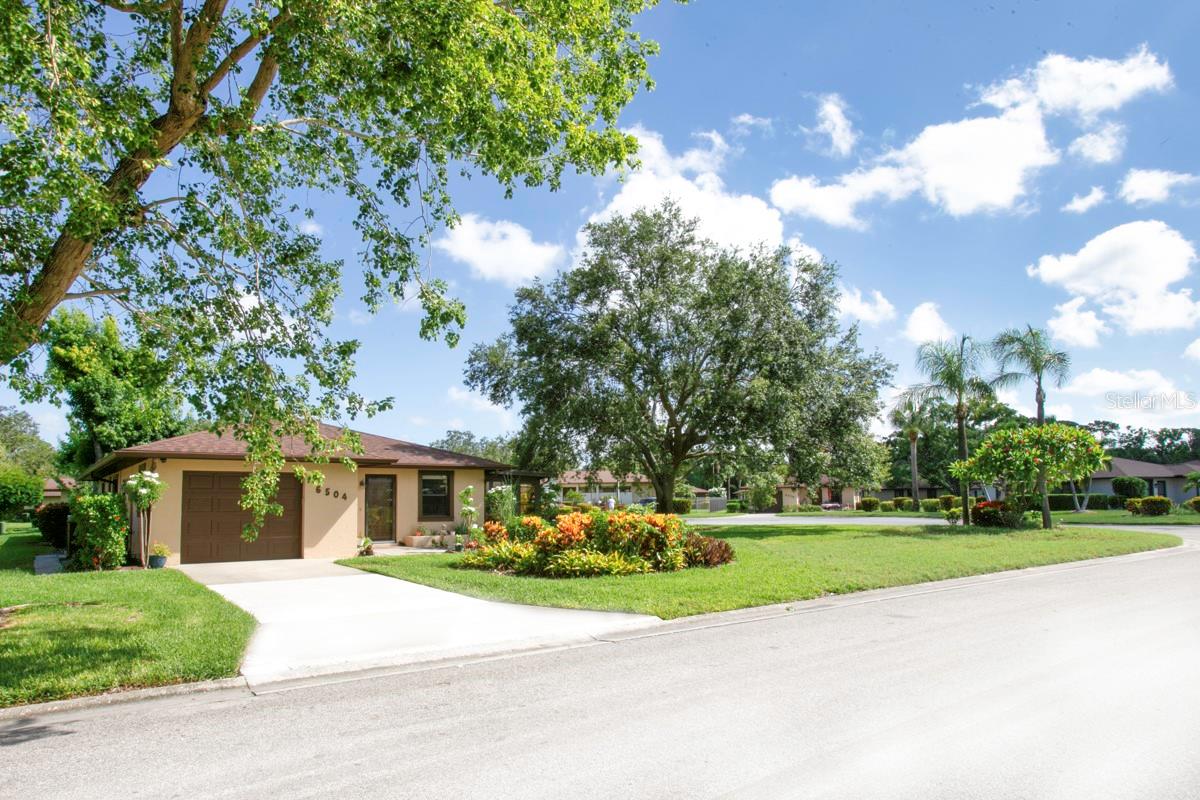 CAMBRIDGE VILAGE WEST has LOW HOA FEE of $293. The SINGLE FAMILY HOME'S beauty goes beyond the STURDY CONCRETE/STUCCO WALLS. The UPDATED/UPGRADED INSIDE IS A DESIGNER INSPIRED 2BD/2BTH with FRENCH DOORS leading out to the ex-tra large AIR-CONDITIONED FLORIDA ROOM used as office/den. The chef's dreams are fulfilled in the spacious kitchen with plenty of beautiful QUARTZ COUNTERTOPS that have a subtle beige veining and everyone's favorite shaker cabinets. The kitchen wall has been removed providing an OPEN FLOOR PLAN. The rooms have been highlighted with new lighting, no popcorn ceilings, and stunning wood-look tile flooring. There is an INDOOR LAUNDRY ROOM/PANTRY/COFFEE BAR that goes out to GARAGE which has new garage door opener and water heater. This HVAC system has been professionally maintained with a new capacitor and filter replacements. This PET FRIENDLY 55+ community has planned get togethers including parties/dinners at the recently decorated and clean club house with a library and kitchen. You'll enjoy the HEATED POOL, shuffleboard court and BBQ grill. The FLORIDA LIFESTYLE doesn't end at your own PIECE OF PARADISE. Take a 5-mile drive to ANNA MARIA ISLAND to put your toes in the soft sand beaches. CAMBRIDGE VILLAGE WEST has easy access to all your needs. Blake Hospital, doctor's offices, GT BRAY Park are a few blocks away. Your choice of grocery store, big box store with a gas station, restaurant and fast food are less than 2 miles away. This location is convenient to St. Armands circle, Ringling Museum, IMG Academy, marinas, golf courses, the arts/entertainment districts of Sarasota or Bradenton's Riverwalk. Our own SRQ airport is a nice benefit for living in the GULF COAST of FLORIDA. It doesn't take long to drive to I-75 for trips to Tampa, Naples, Miami or excursions to Orlando's theme parks.