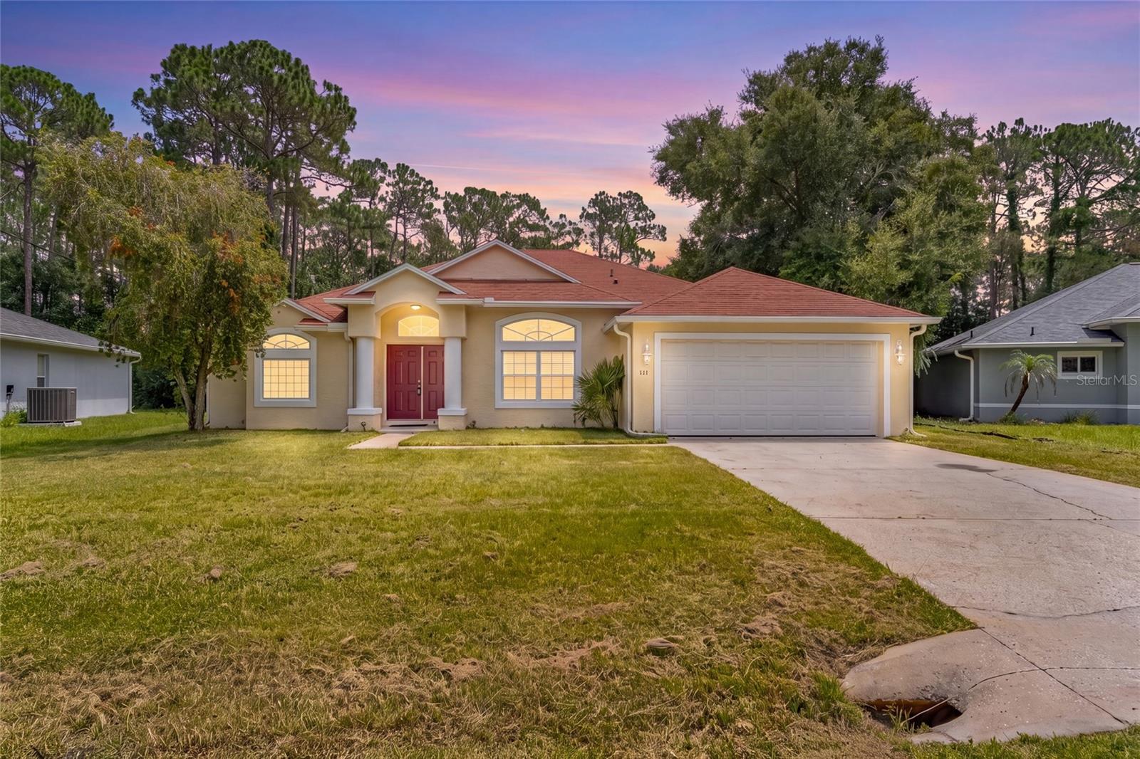 Welcome to this 4-bedroom, 2 bathroom Pine Lakes home. Huge backyard space with tons of potential.  2-car garage. This home offers a comfortable split floor plan and low-maintenance finishes throughout. Enjoy laminate flooring in all main living areas and tile in the bathrooms and other wet spaces, making everyday cleanup quick and easy. The kitchen includes a refrigerator, electric range, dishwasher, and microwave, so you can settle in and start cooking right away. The split bedroom layout provides privacy, with the spacious primary suite set apart from the guest bedrooms. The primary suite features two large, separate walk-in closets, and the primary bath offers a garden jetted tub and a walk-in shower for added comfort. From the roomy living area, step out to a large covered lanai that overlooks an expansive backyard backing to trees, giving you a sense of space and nature. The roof and water heater were both replaced in 2021.
This home is conveniently located near shopping, entertainment, schools, medical offices, and more, with easy access to major roadways and I-95 for quick trips to local beaches, St. Augustine, and Daytona. Property is being sold in as-is condition. Offers are welcome—schedule your showing today