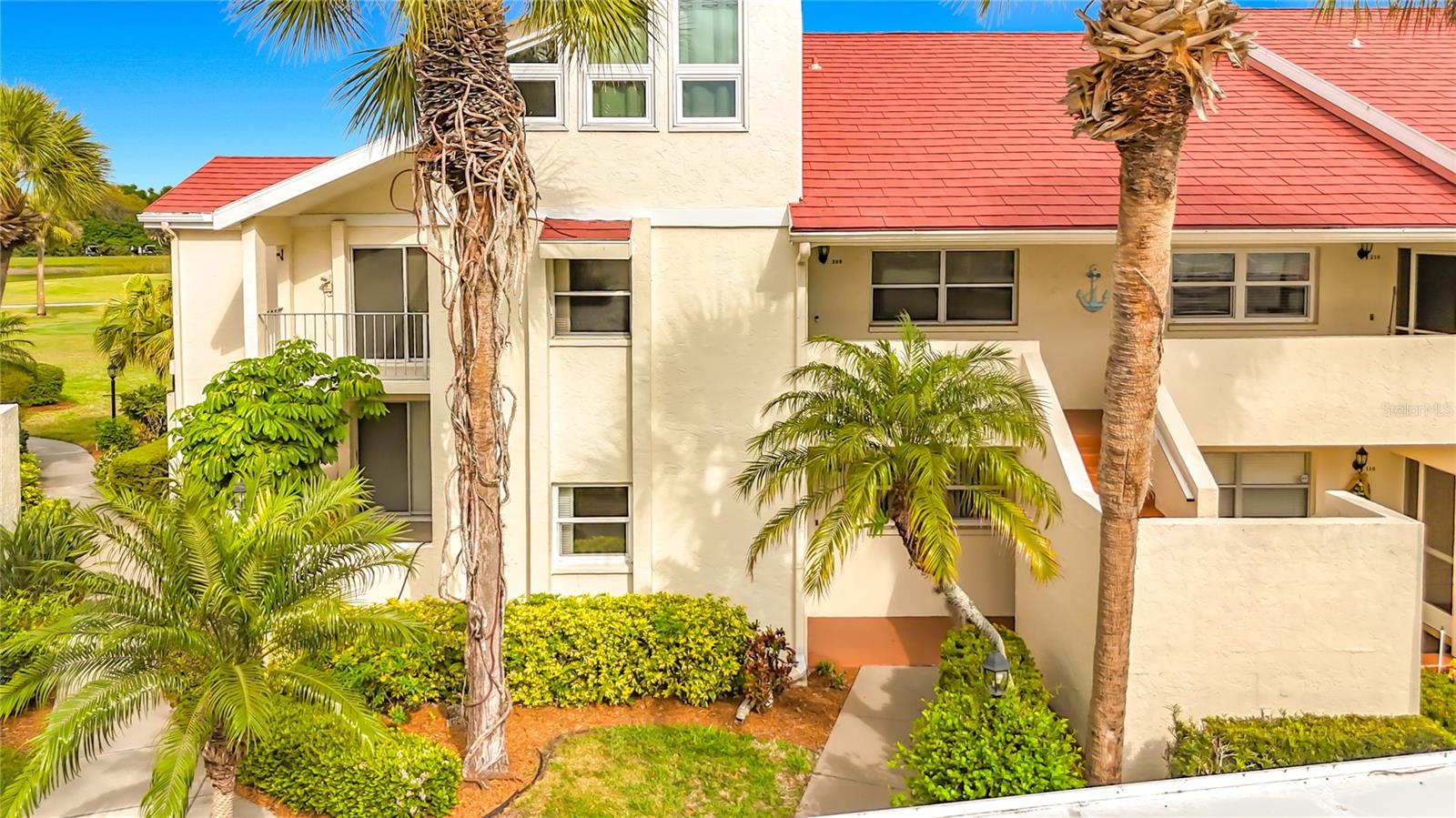 Experience refined Florida living in one of the most sought-after residences in Capri West, ideally located in sunny Venice, Florida. This rare ground-floor, end-unit condo offers over 1,600+ square feet of thoughtfully designed living space - the largest ground-floor floorplan found in the community - and boasts breathtaking, UNOBSTRUCTED GOLF COURSE VIEWS of Capri Isles Golf Course. This spacious 2-bedroom, 2-bathroom condo with covered parking seamlessly blends comfort, style, and low-maintenance living. Lovingly maintained, the home features luxury vinyl plank flooring, brand new hot water heater (2026), a 2019 HVAC system, and a combination of hurricane shutters and impact windows, delivering both modern appeal and peace of mind. The open-concept layout is ideal for both everyday living and entertaining, with a bright, airy kitchen that flows effortlessly into the expansive living and dining areas. The kitchen is appointed with newer stainless steel appliances, abundant cabinetry, breakfast bar, and the convenience of private IN-UNIT LAUNDRY - an exceptional feature not always found in condo living. A versatile, light-filled flex space just off the living room creates the perfect setting for a home office, reading lounge, or creative retreat. Step outside to your private screened lanai and enjoy tranquil golf course views, along with a generously sized storage closet. An additional outdoor common space off the dining area, framed by a privacy wall and lush, mature landscaping, provides yet another peaceful place to unwind. Capri West offers resort-style amenities, including two sparkling community pools (one heated for year-round enjoyment) and a well-managed association with no special assessments on the horizon. This prime Venice location places you just minutes from Historic Downtown Venice, Venice Beach, premier shopping, dining, and entertainment. Golf enthusiasts will appreciate being just steps from Capri Isles Golf Course, while nearby Pinebrook Park offers scenic walking trails and open green spaces. Whether you're searching for a primary residence or seasonal retreat, this exceptional Venice, FL. condo delivers the perfect blend of luxury, location, and lifestyle. Schedule your private showing today and discover the best of golf course living in Southwest Florida. One or more photos have been virtually staged.