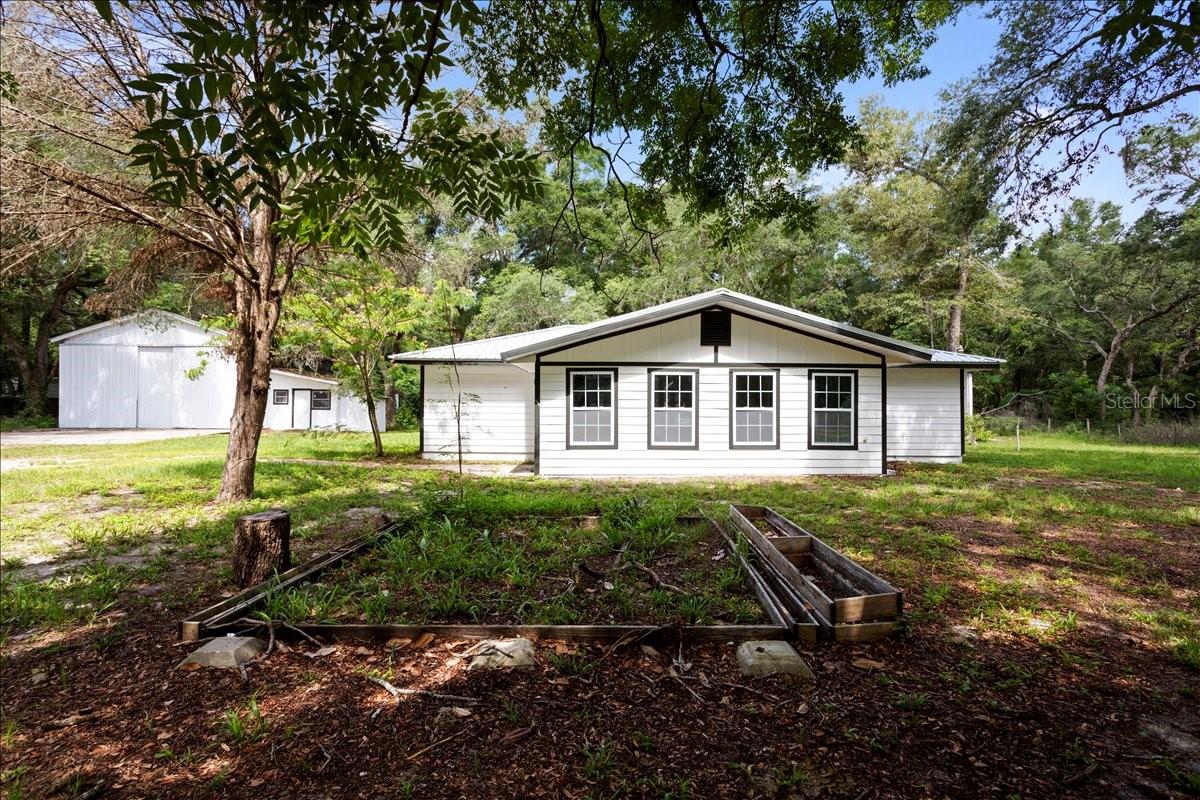Virtually Staged. Motivated Sellers! Welcome home to this beautifully fully renovated 3-bedroom, 2-bath retreat in Trenton, Florida, where modern finishes meet peaceful country living. Thoughtfully updated from top to bottom in 2026, this home offers true move-in-ready confidence with a brand-new metal roof, new appliances, and fresh finishes throughout.
Inside, you’ll love the seamless blend of style and durability with luxury vinyl plank flooring in the main living areas and tile in the kitchen and bathrooms. The stunning kitchen features soft-close cabinetry, stainless steel appliances, and plenty of storage, perfect for both everyday living and entertaining. Both bathrooms have been beautifully updated to match the home’s clean, modern aesthetic.
Storage is abundant throughout the home, and the upgrades continue outside. Situated on a fully fenced and gated one acre lot, the property offers privacy, space, and versatility. Two large outbuildings provide endless options for a garage, workshop, hobby space, or extra storage, and RV hookups make this property ideal for travelers or guests.
The back yard has a concrete in-ground pool, perfect for Florida summers, relaxing weekends, or entertaining friends and family.
With new Hardy plank siding, a new metal roof, updates, and stylish finishes, this home delivers the peace of mind buyers are looking for, without sacrificing charm or functionality. If you’ve been searching for a completely updated property with room to spread out and enjoy the Florida lifestyle, this one checks all the boxes.