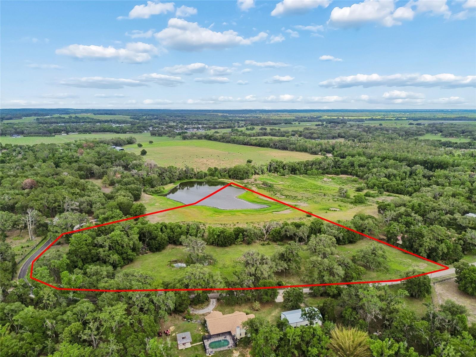 This private 10 acres of land with lake offers a wonderful opportunity for a custom estate, equestrian, and or raise animals. Beautiful escape and sense of seclusion. This versatile parcel offers privacy and natural beauty. Property is cleared and ready for you. You get to enjoy, fish, canoeing, and much more from your own back yard. Must drive by and experience this property.