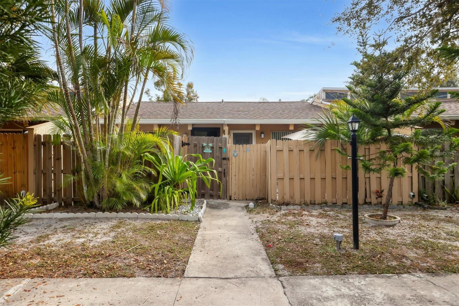 Charming villa-style condo that beautifully blends privacy, natural light, and an unbeatable Sarasota location. Soaring cathedral ceilings create an open, airy feel, enhanced by windows at the apex of the roof that flood the home with abundant natural light throughout the day. The bright and welcoming interior features thoughtful updates and a highly functional layout. As a bonus, the condo has a new A/C!

The primary suite offers a versatile bonus room—perfect for a home office, nursery, workout space, reading lounge, or creative studio—adding flexibility rarely found in similar properties. Step outside to your private, gated patio, ideal for morning coffee, outdoor dining, gardening, or unwinding with a good book.

Tucked away in a quiet community yet just minutes from downtown Sarasota, you’re close to Main Street’s dining, shopping, and entertainment, with Lido Beach only a short drive away. Whether you’re seeking a primary residence, seasonal getaway, or income-producing investment, this home checks all the boxes. Low HOA, low taxes, and a prime location make this a must-see opportunity.