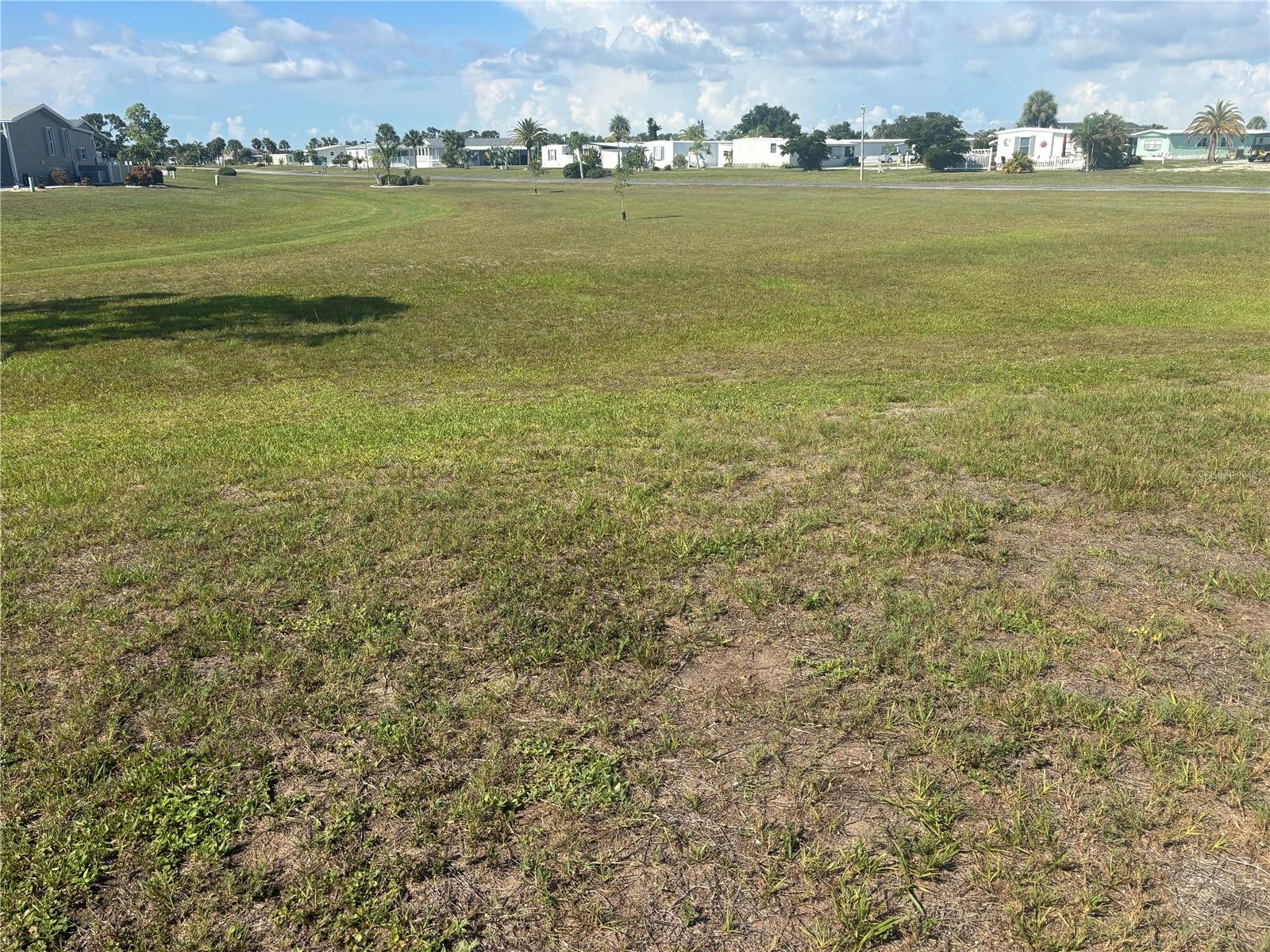 OWN YOUR OWN LAND in the highly sought-after Village of Holiday Lake, a GOLF-CART FRIENDLY, ALL-AGES WATERFRONT COMMUNITY offering the ultimate Southwest Florida lifestyle! This exceptional OVERSIZED CUL-DE-SAC HOMESITE with a greenbelt view presents a fantastic opportunity to place your dream home in a vibrant community with access to Charlotte Harbor and the Gulf. Water and electric are already onsite, making it even easier to bring your vision to life.

Residents enjoy an impressive array of amenities, including 25+ community BOAT SLIPS, a private boat ramp, TWO POOLS, a recreation hall with a full kitchen, FITNESS CENTER, craft room, woodworking shop, laundry facilities, tennis courts, PICKLEBALL, shuffleboard, and numerous social activities throughout the year. All this for a low HOA fee. Outdoor enthusiasts will appreciate easy access to boating, fishing, and NEARBY GOLF COURSES AND GULF BEACHES, where local waterfront dining favorites are just a short drive away by boat or car.

Conveniently located near shopping, dining, entertainment, and everyday conveniences, this property offers the perfect blend of recreation, relaxation, and value with LOW HOA FEES. Whether you're looking for a year-round residence, seasonal retreat, or investment opportunity, this exceptional homesite offers the opportunity to create your own Florida retreat and enjoy everything Southwest Florida has to offer. Bring your vision and start living the Florida dream!