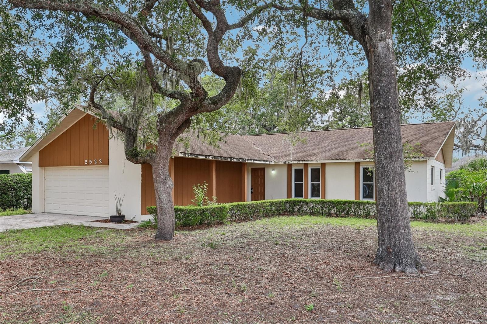 Virtually Staged. Updated double-pane windows and sliding glass door, a NEWER A/C, and a NEWER WATER HEATER provide a great head start on this spacious single-story home in Arbor Ridge West – offering the perfect foundation to personalize and make your own! Situated on an oversized .29 ACRE LOT, on a CUL-DE-SAC street with NO HOA, you will love the FENCED BACKYARD, expansive side yard, and mature trees that create a sense of space rarely found at this price point. Inside, the living room, dining area, and kitchen flow comfortably together, creating an inviting layout filled with natural light. Sliding glass doors off the dining area lead to the COVERED LANAI, extending your living space outdoors. The kitchen offers pantry storage, a casual EAT-IN SPACE, and plenty of potential to design the kitchen of your dreams. The PRIMARY SUITE features a WALK-IN CLOSET and private bath, while bedrooms two and three share a second full bath off the hall. With three bedrooms, two full baths, and a flexible layout, this home is ready for its next chapter. You will also enjoy the convenient East Orlando location with easy access to SR 417 and SR 50, just minutes from UCF, Waterford Lakes Town Center, shopping, dining, and recreation. Nearby Blanchard Park and the Jay Blanchard Trail offer endless opportunities to get outdoors and enjoy the Florida lifestyle. Easy to show, call today to schedule a tour and let Arbor Ridge West welcome you home!