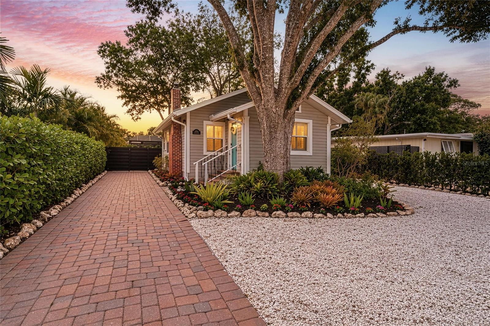 NESTLED IN THE HEART OF SARASOTA- This home in the coveted Arlington Park neighborhood, beautifully updated 1925 Florida cottage blends timeless character with luxurious modern upgrades just minutes from downtown Sarasota and the world-renowned Gulf Coast beaches. Surrounded by charming tree-lined streets, quaint historic homes, and a vibrant lifestyle, this exceptional property offers the perfect opportunity for full-time living, seasonal enjoyment, or investment potential in one of Sarasota’s most desirable locations.

Rich in Sarasota history, this home was originally built for the grove master when the surrounding area was covered in orange groves owned by the Palmer family. Today, it has been thoughtfully restored while preserving its authentic Old Florida charm. There has been nearly $100,000 in recent improvements and renovations that have been completed, including a new roof, soffit, fascia, gutters, landscaping, doors, hurricane impact windows, foundation support and encapsulation with a 25-year warranty, updated plumbing and electrical systems, newer A/C, plantation shutters, flooring, and more. The home was professionally lifted with an entirely new foundation in 2020, giving buyers peace of mind while maintaining the integrity and character of this historic gem.

Inside, luxury vinyl flooring that resembles the original pine flooring flows throughout the home, complemented by crown molding, abundant natural light, and designer touches in every room. The inviting living room features custom shelving and a charming brick fireplace. The beautifully updated kitchen showcases stainless steel appliances, custom cabinetry, granite countertops, decorative tile accents, and a breakfast bar ideal for casual dining and entertaining. Each bedroom offers its own cozy charm, while the thoughtfully designed laundry room includes built-in storage for added functionality.

Situated on an oversized lot, the possibilities are endless. The spacious backyard offers ample room for a pool, expansion of the existing home, or the addition of a garage with an ADU above for exceptional rental income potential. 

The paved driveway leads to a charming car cabana, while the detached shed provides additional storage  for items like bicycles and garden tools. With no HOA, no CDD fees, and no rental restrictions, this property offers unmatched flexibility for homeowners and investors alike.

Residents enjoy easy access to the beloved Arlington Park & Aquatic Complex featuring a 50-meter lap pool, instructional pool, tennis courts, indoor and outdoor basketball courts, playground, outdoor fitness gym, walking trails, and a dog park. Ideally located near Sarasota Memorial Hospital, shopping, dining, and entertainment, this home offers both convenience and lifestyle appeal. Just minutes away, downtown Sarasota awaits with fine dining, boutique shopping, cultural attractions, marinas, and the iconic The John and Mable Ringling Museum of Art — all part of what makes Sarasota one of Florida’s premier coastal destinations.

This extraordinary property captures the essence of Sarasota living: historic charm, modern luxury, investment opportunity, and an unbeatable location — all offered at an exceptional value.