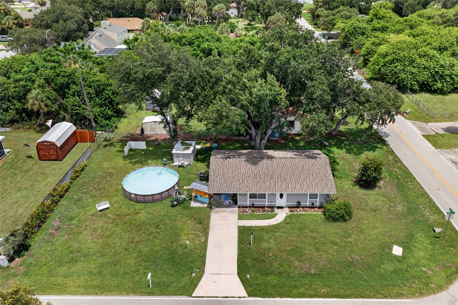 MOVE-IN READY HOME ON AN OVERSIZED CORNER LOT WITH MODERN UPDATES! Welcome to this charming 2-bedroom + den, 1.5-bathroom home offering a comfortable layout, tasteful updates, and a convenient Port Charlotte location. Situated on a spacious corner lot, this home is perfect for first-time buyers, seasonal residents, downsizers, or investors looking for a well-maintained property with plenty of potential.

Step inside to discover an inviting open-concept floor plan that creates a bright and airy feel throughout the main living spaces. Luxury vinyl plank flooring extends through most of the home, providing both style and easy maintenance. The kitchen is equipped with stainless steel appliances and opens seamlessly to the living and dining areas, making everyday living and entertaining effortless.

The generously sized primary bedroom offers a comfortable retreat and features its own ensuite half bathroom for added convenience. A versatile den/bonus room provides the flexibility to create a home office, hobby room, guest space, or additional sitting area to fit your lifestyle.

Outside, you'll find an expanded paver patio just off the carport, creating the perfect spot to enjoy your morning coffee, grill with friends, or unwind in the Florida sunshine. The corner lot provides additional yard space and enhances the home's curb appeal.

Additional highlights include a NEW ROOF (2022), helping provide peace of mind for years to come.

Conveniently located near shopping, dining, parks, schools, golf courses, medical facilities, and just a short drive to Southwest Florida's beautiful beaches, this charming home offers an excellent opportunity to enjoy everything Port Charlotte has to offer.

Don't miss your chance to make this delightful property your own—schedule your private showing today!