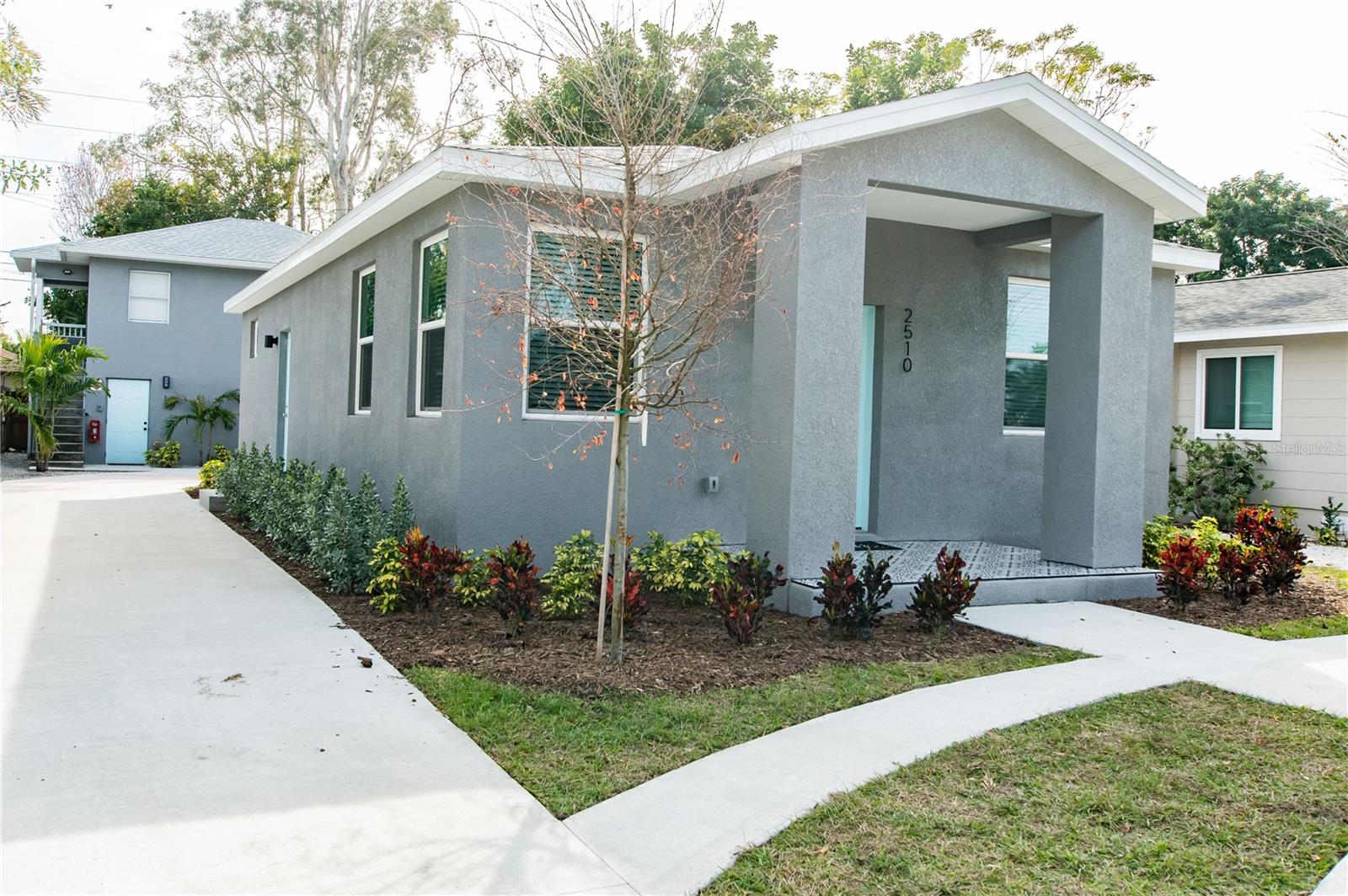 A 1031 Buyer or House Hacker's Dream! This rare, fully legal, and licensed triplex in sought-after North Kenwood is a true plug-and-play asset! The property is fully furnished and occupied with 5 income streams, averaging over $7,250/mo in rental income (2025 actual). The main home is a 3/2 block home custom-built by the seller in 2023, consistently rented by the room to three separate roommates (T-12 occupancy 96%) and averaging around $3,800/mo in rental income. The rear building is a 1950s block structure that was completely renovated in 2022 to include new electrical, plumbing, and central HVAC; the rear bldg roof was replaced in 2020. This rear building is a 2-story up-and-down duplex with two fully furnished 1/1 apartments averaging $2,000/mo each (T-12 occupancy 97 %, with only 14 nights of vacancy between the two apartments). The property attracts snowbirds, digital nomads, and returning annual guests, and is professionally managed with a comprehensive tech stack that includes dynamic pricing, listing syndications, and smart integrations (ongoing management is available for a true hands-free investment).High and dry with no flood insurance requirement or HOA, the property features three electric meters, 5 parking spaces, and a shared paver patio courtyard with a BBQ and fire pit. All three units have indoor laundry and central HVAC. Survey, 4-point, wind mitigation, rental license, and other documentation are attached. A 1031 buyer could snap this up with low/no debt service and utmost confidence in high occupancy/income and very low CapEx, while a house-hacker could pick this up with as little as 5% down (or less for FHA/VA), occupy any of the units, and still maintain 4 separate income streams! FHA/VA ready with almost no appraisal risk for financed buyers (property appraised for $825k in 2023 upon completion of construction, during a tighter credit market, before utilities were even connected).