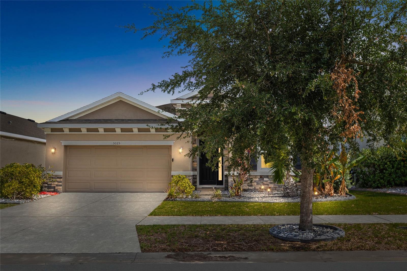 Welcome to 5025 Jackel Chase Drive, a beautifully maintained 4-bedroom, 2.5-bathroom home with pond views located in the highly sought-after Southshore Bay Lagoon community in Wimauma, Florida. Built in 2018 and offering over 2,000 square feet of living space, this move-in-ready home combines modern design, functional living, and resort-style amenities.

Step inside to discover an open-concept floor plan featuring spacious living and dining areas, ceramic tile flooring in the main living spaces, and abundant natural light. The chef-inspired kitchen is designed for everyday living and entertaining, complete with granite countertops, a large center island with seating, 36-inch cabinetry, stainless steel appliances, and a corner pantry.

The split-bedroom layout provides privacy and flexibility, while the spacious primary suite offers a peaceful pond view, dual walk-in closets, a double-sink vanity, soaking tub, and walk-in shower. Additional features include ceiling fans, updated light fixtures, a covered and screened lanai, irrigation system, rain gutters, and a fully fenced backyard overlooking the water.

Enjoy Florida living at its finest with access to the world-famous Southshore Bay Metro Lagoon, featuring a crystal-clear lagoon, sandy beaches, water slides, kayaking, paddleboarding, swim-up bar, cabanas, playgrounds, fitness center, clubhouse, dog park, and year-round community events.

Conveniently located near I-75, Tampa, Sarasota, MacDill Air Force Base, shopping, dining, healthcare facilities, and Florida Gulf Coast beaches, this home is ideal for buyers seeking a waterfront lifestyle, resort-style amenities, low-maintenance living, and easy access to Tampa Bay.

If you've been searching for a move-in-ready home in Wimauma, a Southshore Bay Lagoon home for sale, a pond-view property, or a Florida home with resort-style amenities, this one deserves a spot at the top of your list.

Schedule your private showing today and experience the Southshore Bay lifestyle for yourself.