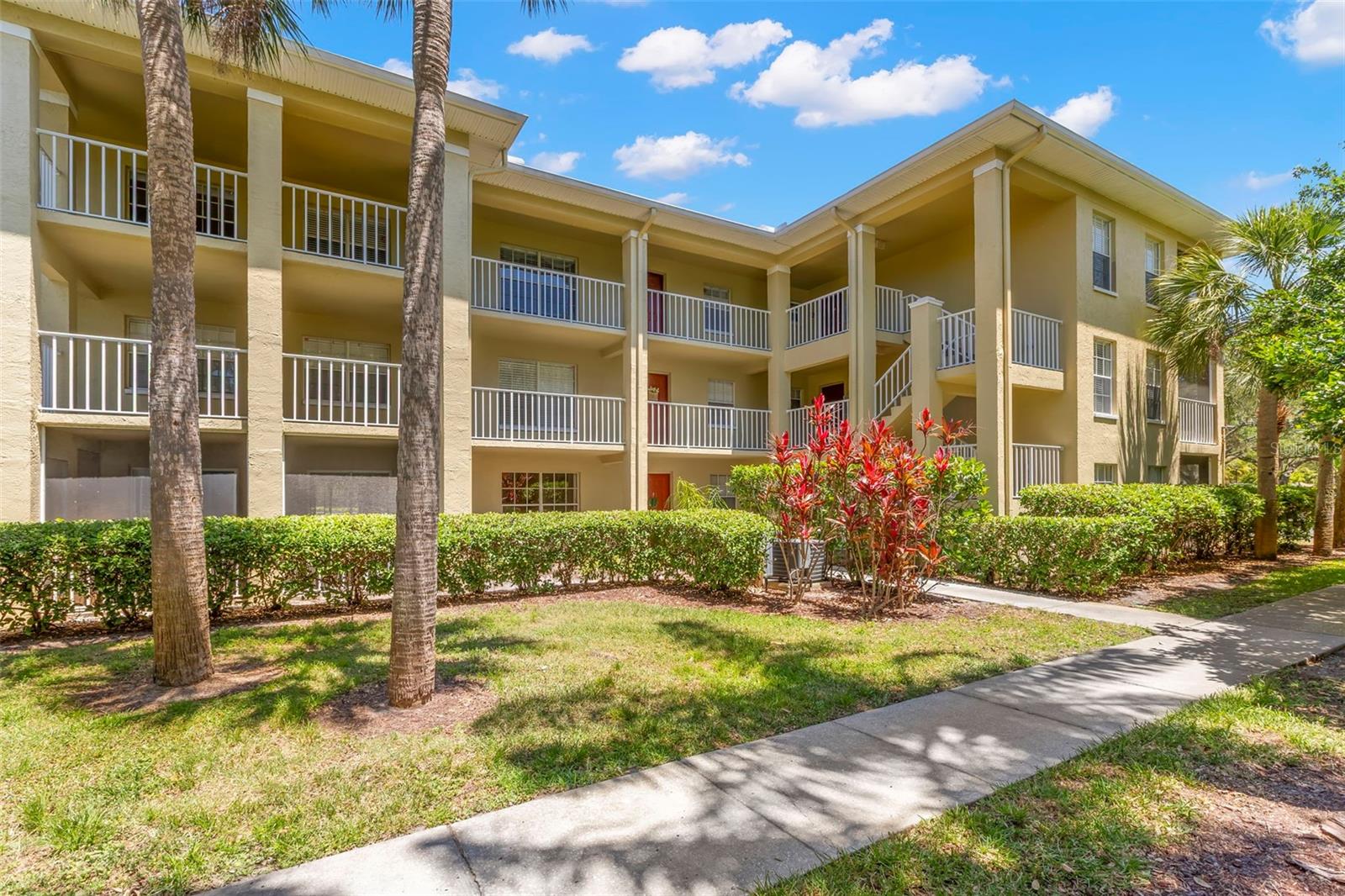 Step into easy Florida living with this charming first-floor 1-bedroom, 1-bath condo in the desirable Meadowlake community of Palm Harbor with a low HOA fee compared to most that include a water, trash, sewer, community pool, ground and building maintenance! Whether you're looking for a smart investment opportunity (6-month minimum rentals allowed) or a place to call your own, this property offers flexibility and comfort. Inside, you’ll find an open and inviting living and dining space filled with natural light. Luxury vinyl flooring runs throughout, offering both style and low-maintenance living. The spacious living room flows seamlessly into the dining area, highlighted by a modern hanging light fixture. The kitchen is well-equipped with ample cabinetry, a double stainless steel sink, dishwasher, microwave, range, and refrigerator—everything you need for everyday convenience. Down the hall, you’ll find a full-size washer and dryer neatly tucked into a closet. The bedroom offers a peaceful retreat, complete with sliding glass doors leading to your screened-in porch—perfect for enjoying Florida’s beautiful weather year-round. The full bathroom features a tub and shower combination, and there’s additional storage space in the hallway. Beyond your front door, the Meadowlake community offers an impressive array of amenities, including a pool, tennis court, playground, beach volleyball court, shuffleboard, covered pavilion with picnic tables and grills, and a scenic pond with a water feature. Located in the heart of Palm Harbor, you’ll enjoy convenient access to US Highway 19 and Tampa Road, putting shopping, dining, and entertainment just minutes away. Don’t miss your chance to own this well-located and versatile condo—schedule your showing today!