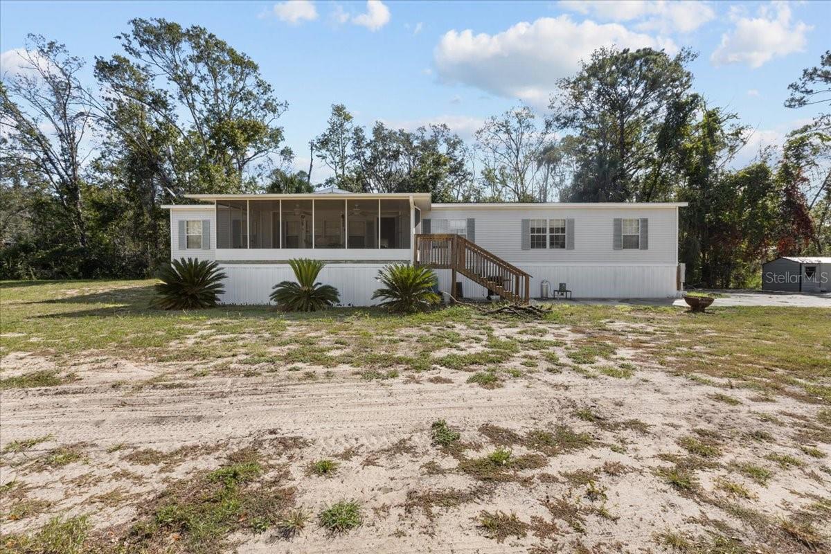 A VERY spacious 4 bed/ 2 bath furnished home on just over 1 acre close to everything in Steinhatchee!! $5000 Credit for New Flooring! New Range and New Blinds through-out!  The master Bedroom has 2 walk-in closets and a big bathroom!!  Another large bedroom off the living room has French doors. Spacious Living Room with wood burning fireplace, there's a separate Dining Room and lots of storage!  There's a big screened-in front porch for those beautiful evenings!  Large concrete pad, freezers negotiable. You'll have tons of room here for outdoor Florida living!