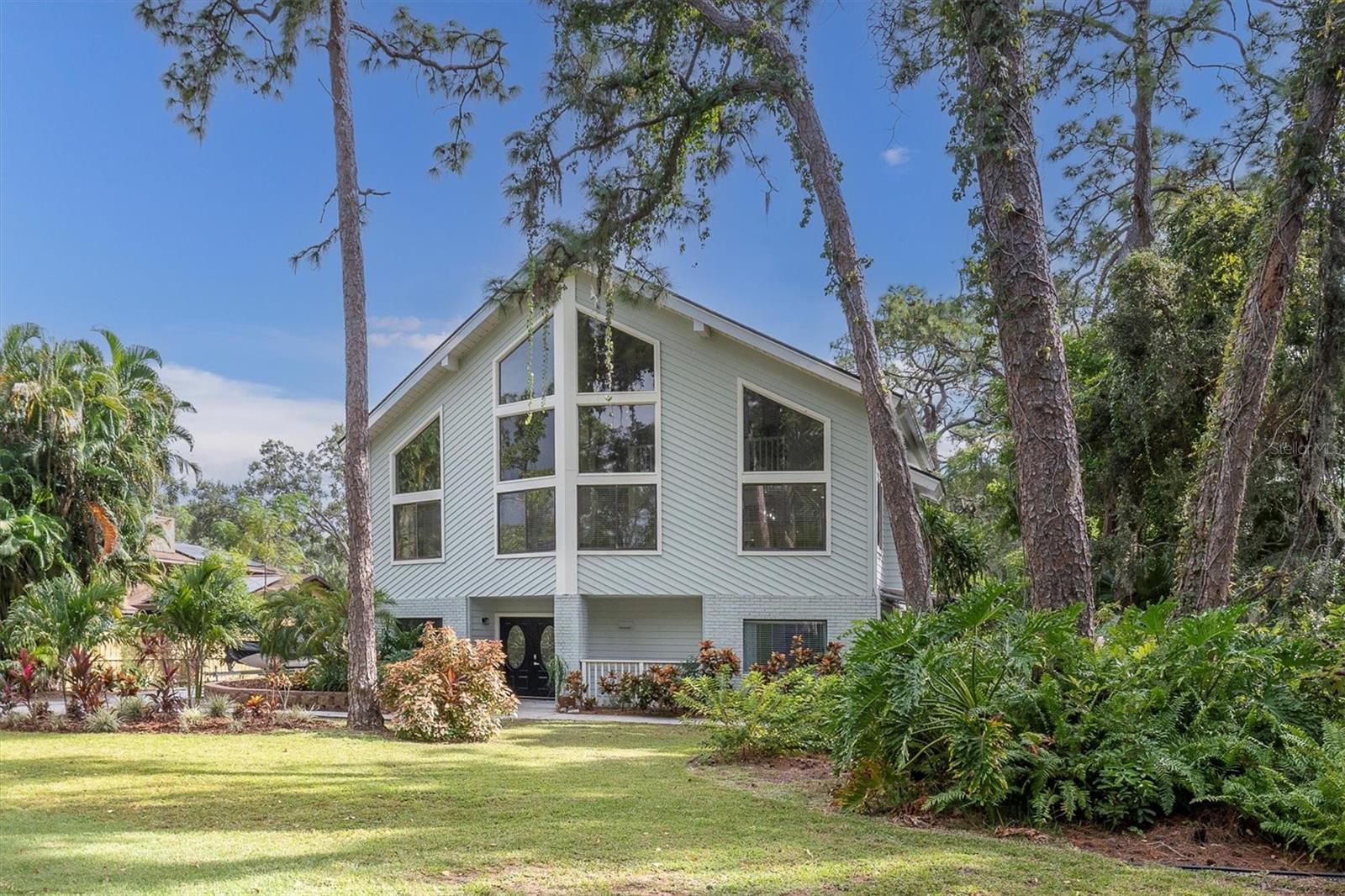 A Rare Gem in the Heart of Seminole - 
This unique and exceptional home is NOW AVAILABLE — located in one of Seminole’s most sought-after “sweet spots” along 74th Avenue, safely set in an X Flood Zone. From the moment you arrive, the striking full glass-paneled front makes a statement of elegance and class.
Inside, discover THREE STORIES OF INSPIRED LIVING. The main portion of the home spans two floors and features 3 bedrooms, 2.5 baths, and an abundance of thoughtfully designed spaces — including a spacious kitchen, living and dining rooms, utility room, office, and cozy sitting area.
The living and formal dining rooms exude a grand, open atmosphere with CATHEDRAL-STYLE HARDWOOD PAINTED CEILINGS and a touch of modern ambiance from the BUILT-IN ELECTRIC FIREPLACE.
The kitchen has been tastefully remodeled to perfection — boasting custom KraftMaid wood cabinetry, a Zline 6-burner gas stove with matching hood and pot-filler, a center island with Cosmo drawer microwave, quartz countertops, farmhouse sink, wine refrigerator, and stainless steel appliance suite.
The PRIMARY BEDROOM is open, light, and airy — featuring a DOUBLE-SIZED LAYOUT with en-suite bath and walk-in closet. The second floor also offers a half bath, laundry area, and a charming sitting room with FRENCH DOORS LEADING TO THE PATIO, GAZEBO, POOL AND POND.
The THIRD FLOOR hosts bedrooms two and three, both with vaulted ceilings and private balcony access overlooking the tranquil backyard. A SPACIOUS THIRD BATHROOM WITTH JACUZZI TUB and an OVERSIZED WALK-IN CLOSET with ATTIC ACCESS for additional storage (connected to Bedroom 2 and accessible through the bathroom) complete the level, along with a 10x14 OFFICE SPACE WITH VAULTED CEILING, built in cabinets, shelving and desk overlooking the living and dining area..
But that’s not all — this home includes a RARE BONUS FEATURE: a FIRST-FLOOR IN-LAW SUITE with IT’S OWN PRIVATE ENTRANCE. This self-contained space includes one bedroom, one bath, dinette, and washer/dryer — ideal for extended family or guests. A private landscaped patio with awning provides a peaceful entryway to the backyard.
Throughout the home you’ll find 12mm AQUA GUARD LAMINATE FLOORING, 6 PANEL DOORS, 5” BASEBOARDS, and QUARTZ COUNTERTOPS tying the spaces together in timeless style.
Step outside to your own backyard paradise — complete with a 13x25 SALTWATER HEATED POOL WITH FOUNTAIN (installed 2022), PAVER PATIO, 14x10 GAZEBO, 8x10 shed, and even a POND FILLED WITH TILAPIA AND TURTLES! The property also boasts MANGO, AVACADO, PEACH, AND GUAVA TREES — a true Florida dreamscape.
Let’s not forget to mention that this PARADISE OASIS is a 5 MINUTE DRIVE TO OUR BEAUTIFUL SANDY BEACHES WITH STUNNING SUNSETS, just a few blocks from BOCA CIEGA MILLENNIUM PARK,( a 186 acre nature park with a 35 ft. observation tower, boardwalks, playground, dog park and accessible to the Pinellas Trail), close to SEMINOLE SCHOOLS including Richard O. Jacobson and St. Pete College, restaurants and the popular Seminole City Center.