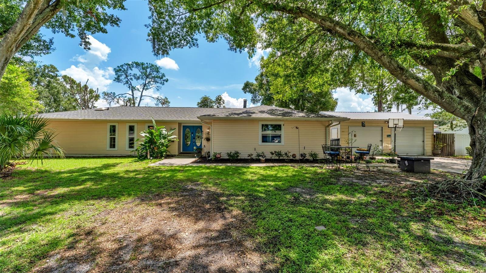 Welcome to this beautifully maintained 4-bedroom, 2-bathroom POOL home that perfectly combines comfort, functionality, and exceptional outdoor living. From the moment you step inside, you'll appreciate the inviting layout designed for both everyday living and effortless entertaining.
The spacious kitchen offers generous counter space, a convenient breakfast bar, and an open design that flows seamlessly into the main living area, making it easy to stay connected while preparing meals or hosting family and friends. The cozy fireplace creates a warm focal point in the living room, while the covered back patio is the perfect spot to enjoy your morning coffee or relax in the evening. In addition, a versatile bonus room provides the perfect space for a game room, playroom, or even an additional bedroom to suit your needs.
The thoughtfully designed split-bedroom floor plan provides added privacy. The spacious primary suite features a walk-in closet, dual vanities, and a private ensuite bathroom. Three additional bedrooms offer comfortable accommodations with ceiling fans, plush carpeting, and generous closet space.
Step outside and discover your own backyard oasis. The sparkling swimming pool is perfect for cooling off on warm Florida days, while the large, fully fenced backyard offers endless possibilities for pets, play, gardening, or entertaining. A covered patio provides additional outdoor living space, and the separate storage shed keeps lawn equipment and outdoor essentials neatly tucked away.
Car enthusiasts, hobbyists, and those needing extra storage will love the detached two-car garage, offering endless possibilities for a workshop, home gym, or additional parking.
Whether you're hosting gatherings by the pool, enjoying peaceful evenings on the patio, or simply appreciating the spacious indoor and outdoor living areas, this home has something for everyone. Don't miss your opportunity to make it yours—schedule your private showing today!