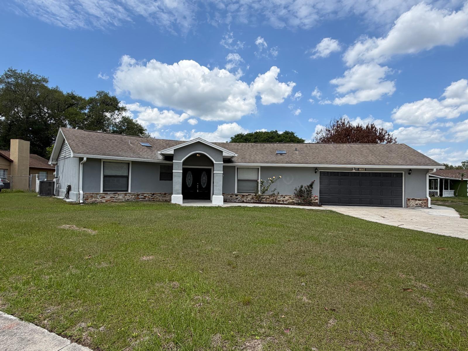 Welcome to this beautifully renovated 4-bedroom, 3-bathroom single-family home. The house features a skylight in the living room, perfect for relaxing or entertaining year-round. Situated on an oversized 12,545 sq ft lot, this property offers space, privacy, and endless possibilities—with NO HOA, giving you the freedom to personalize, expand, or invest without restrictions. Ideally located just minutes from Disney, Universal, and SeaWorld, with quick access to the Turnpike, shopping, dining, and only one hour from the beach, this home places you in the heart of Central Florida’s most desirable attractions. Move-in ready and thoughtfully updated, this property is perfect as a primary residence, vacation home, or income-producing investment. Don’t miss this opportunity—schedule your private showing today.