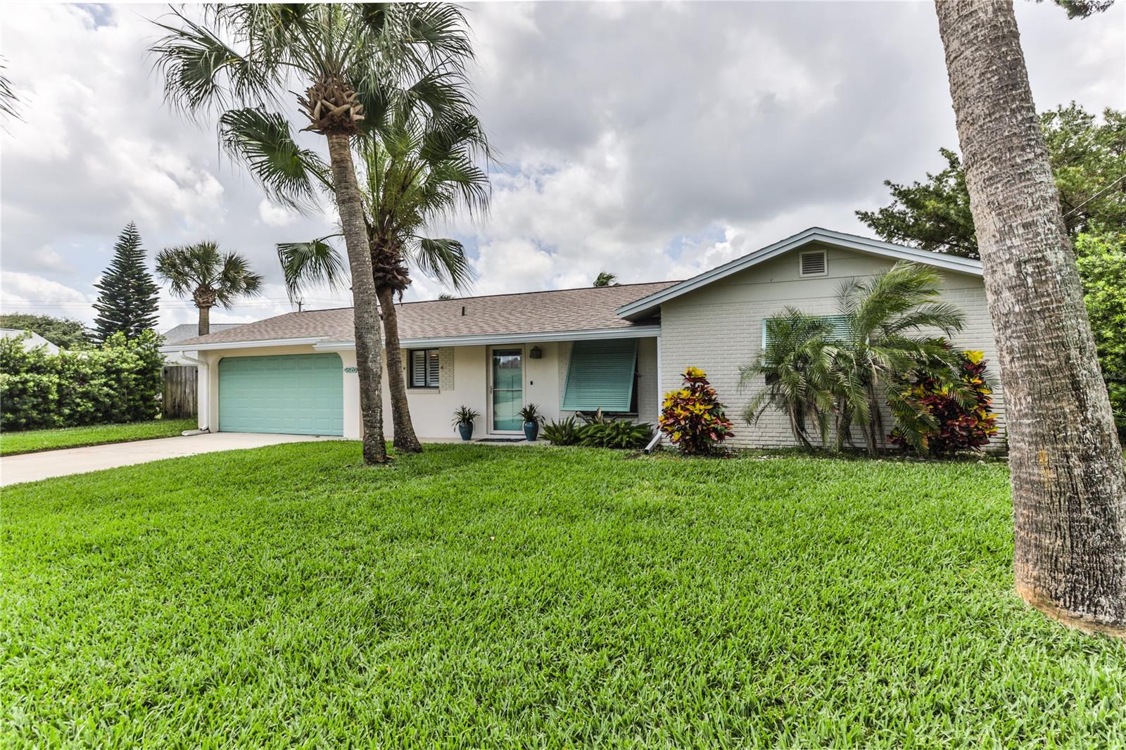 The perfect beach getaway or snowbird home. Tastefully and beautifully remodeled from all new flooring to new roof (Jan 2020), upgraded kitchen complete w/breakfast bar and lovely subway tile backsplash, updated baths, huge screened back porch overlooking the enticing inground pool and you still have ample yard for pets. This home shows TLC throughout--it is truly in move in condition. Walk to the beach--it doesn't get any better than this! All information deemed reliable but not guaranteed. ;Water: City
