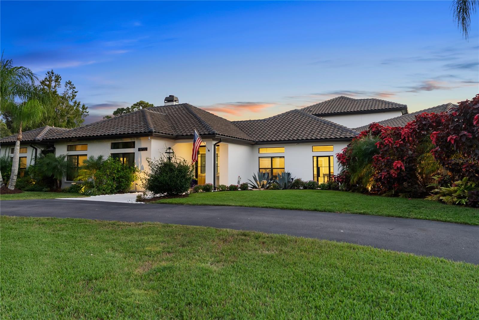 Set on over seven acres within Panther Ridge, this private estate offers a rare combination of acreage, privacy, and flexibility in a deed-restricted community. Surrounded by mature landscaping, open pasture, and preserve views, the property is designed for buyers seeking space, privacy, and the ability to shape a property over time. The custom-built residence offers six bedrooms, five and a half baths, and multiple living zones that support multigenerational living, hosting, or working from home. Natural light fills the home through large windows that frame views of the surrounding acreage, creating a calm connection between indoor and outdoor spaces. The primary suite functions as a private retreat, while additional bedrooms, including an upstairs suite, provide separation and versatility for guests or extended family. Formal and casual dining areas, a breakfast nook, and an upstairs office allow the home to function comfortably at scale. Outdoors, the lifestyle truly expands. A resort-style pool and spa, outdoor sauna, and expansive lanai overlook a private pond and open green space ideal for horses, gardens, trails, or future structures. Agricultural zoning allows for barns, additional buildings, or expansion opportunities rarely available in luxury communities. Located in Panther Ridge, residents enjoy equestrian trails, nature preserves, and an estate-style setting while remaining minutes from the dining, shopping, and conveniences of Lakewood Ranch. This property offers a rare opportunity to own significant acreage with flexibility, privacy, and long-term value in one of East Manatee County’s most sought-after communities.