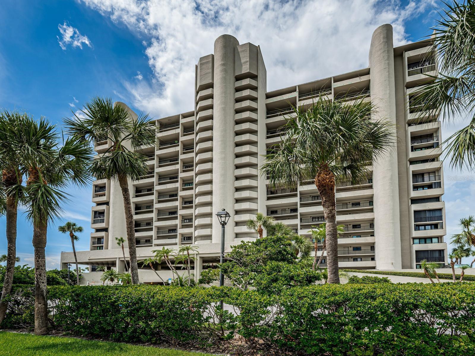 Presenting Lighthouse Towers # 2003 Top Floor Gulf of Mexico Panorama; NEWLY RENOVATED with THOUGHTFUL Interior Design Elements. Spacious 2-bedroom, 2 bath Contemporary GULF-FRONT Residence with attentiveness to Ambiance, Amenities & Features including NEW Plank Floor Tile with 6-inch Baseboard Throughout.  Exceptional Beach Light & Bright Residence incorporating an impressive array of textures, Contemporary palette & finishings. Open Cucina with Quartz surfaces, Shaker Cabinetry, backsplash, recessed lighting equipped with Brand New stainless appliances & Moen fixtures. Master Suite boasts upgraded modern bath Features a Spacious Walk-In Shower, dual sink vanities accessorized with Moen fixtures, offering a relaxed Harmony, seascape views with private terrace access and Walk-In Closet.  Sliding doors open onto the generous size terrace providing an abundance of natural light & aquamarine seascapes. 2nd Bedroom Ensuite ensures guest privacy featuring intracoastal & lighted harbor views! INTERIOR LAUNDRY HOOKUP FOR YOUR WASHER AND DRYER. Your own reserved under building covered parking space. Lighthouse Towers is a gated community providing the finest of amenities including a gulf-front heated pool & Spa, Cover Cabana poolside with Grill area, Tennis & Pickleball court, shuffleboard & Basketball ideal for the perfect beach day!  On-site management & 24-hour Gated Security provide for convenience & peace of mind. Additionally, Reserved parking, storage for your beach gear and kayak & attentiveness to the surrounding landscaped green space & beach frontage designed to enhance beauty and values. This gulf-front community is ideally located to coveted fine dining & shopping with convenient trolley transportation. Spectacular condo, open floor plan, within an attractive price point. Take advantage of the discerning owner's design vision and turnkey convenience. BEST VALUE on the BEACH!   Brand NEW Frigidaire Stainless Kitchen Equipment package 2026; Brand NEW State 40 Gallon Water Heater 2026. One or more photo(s) was virtually staged.