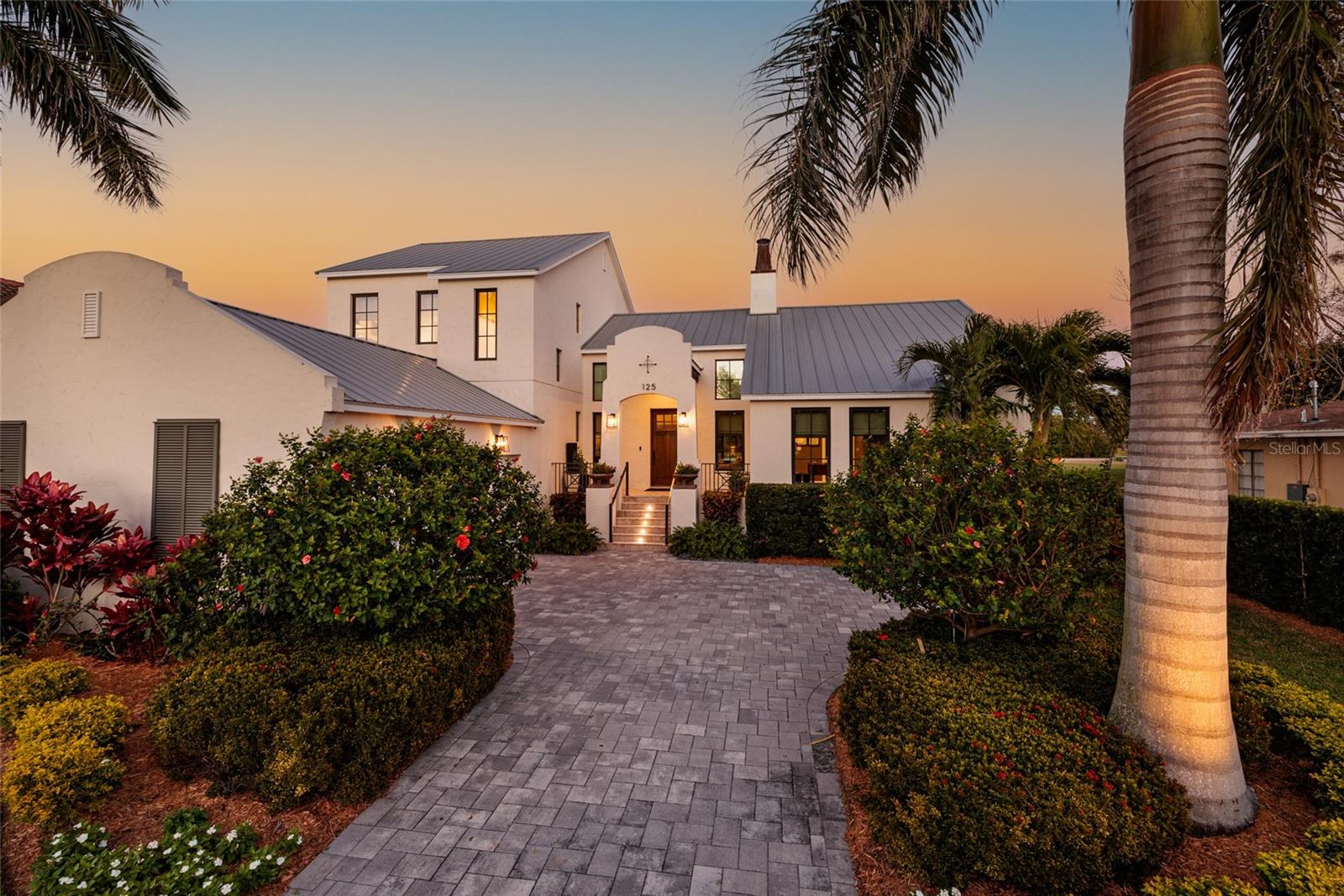 This exceptional custom residence captures the essence of refined coastal living with a level of quality and detail rarely found in today's market. Perfectly positioned to take advantage of sweeping golf course vistas, the home offers a seamless blend of architectural elegance and relaxed sophistication. Interiors are defined by expansive light filled spaces, premier finishes and timeless aesthetic that transcends trends.
The chef's kitchen serves as the heart of the home, complemented by beautifully appointed living and dining areas that open effortlessly to the outdoors.   The private primary suite is a true retreat, offering spa inspired bath and generous wardrobe space, while guest accommodations provide comfort and privacy for family and visitors alike.  Every element has been carefully curated to deliver both beauty and function.  Outdoors, a resort style setting unfolds-featuring multiple lounging areas designed to embrace Florida's year-round lifestyle. Framed by manicured surroundings, the outdoor living experience is as compelling as the interiors. With limited opportunities available within this golf course enclave, the residence represents a rare offering where location, design and craftsmanship converge-creating a home that stands apart from typical market comparisons.   Timeless...Refined...Effortlessly livable.  Welcome home