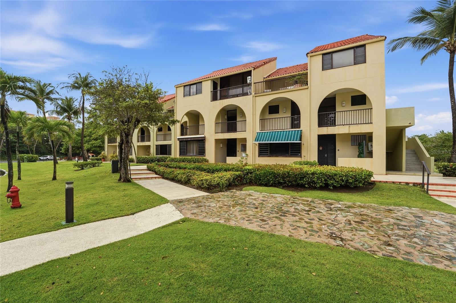 Welcome to Beach Village at Palmas del Mar -- one of Humacao's most sought-after resort communities on Puerto Rico's eastern coast.
This beautifully renovated 3-bedroom, 2-bathroom apartment offers 1,388 square feet of thoughtfully updated living space designed for comfort and an elevated island lifestyle. From the moment you walk in, the quality of the renovation is evident -- modern finishes throughout, central air conditioning, and a fully equipped kitchen with appliances included. Step out onto your private terrace and enjoy serene garden and golf course views -- a peaceful backdrop that makes every morning feel like a retreat. PROPERTY HIGHLIGHTS: - 2 Bedrooms / 2 Full Bathrooms - 1,388 Sq Ft | Fully Renovated - Private Terrace with Golf Course Views - Central Air Conditioning - Appliances Included (No Washer Dryer) - 2 Assigned Parking Spaces - Community Pool (Beach Village) - HOA Included COMMUNITY AMENITIES -- PALMAS DEL MAR: Palmas del Mar is one of Puerto Rico's premier master-planned communities, offering a resort lifestyle with world-class amenities just steps from your door: - Direct Beach Access -- just a 4-minute walk from the unit - Marina Access within the community - Golf Course (separate membership available) - Gated community with 24/7 security - Minutes from restaurants, retail, and recreational facilities LOCATION: Situated just 10 minutes from PR-53, Beach Village offers easy connectivity to the rest of the island while maintaining the tranquility of a private coastal enclave. AIRBNB ALLOWED