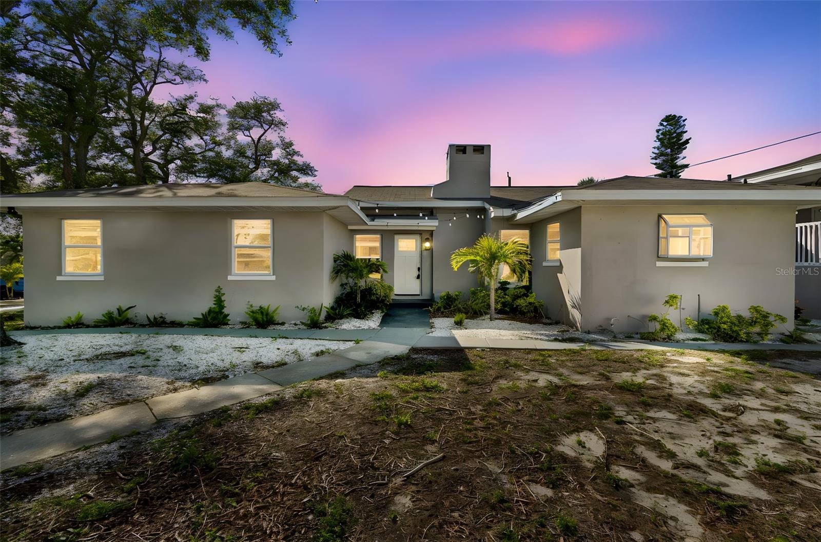 Welcome to 125 Harbor Bluffs Drive in Largo, a spacious 4-bedroom, 3-bath split-level home where flexibility, functionality, and an inviting layout come together in the well-established Harbor Bluffs community. Offering multiple living areas and a versatile floor plan, this property presents an appealing opportunity for a variety of living arrangements while providing the foundation to personalize and enhance over time.
The main living area features an open layout connecting the living room, dining space, and kitchen, creating a natural flow for everyday living and gatherings. A fireplace serves as a focal point, adding warmth and character to the space. The kitchen has been updated with stone countertops and stainless steel appliances, and both bathrooms on the main level also feature stone surfaces, providing a cohesive and refreshed feel throughout the home. The main level includes a primary bedroom with an ensuite bath, along with two additional bedrooms and a guest bathroom. French doors from the main living area lead out to a generous patio and pool area, offering ample space for outdoor dining, relaxing, and entertaining. The fenced yard and expansive deck create additional opportunities for outdoor enjoyment, including space for a future grill station or outdoor kitchen setup. 
The lower level offers a large bonus room along with an additional flex space, ideal for a media room, game room, playroom, home office, hobby or craft area, fitness space, or extended living area. The upper level features a private guest suite complete with a living area, bedroom, and full bath, along with its own exterior entrance, offering flexibility for extended guest accommodations or a private retreat.

Additional features include a circular driveway providing convenient access and additional parking. The Harbor Bluffs neighborhood is known for its established setting and proximity to a variety of local amenities. The property is located approximately 3 miles to Indian Rocks Beach and Belleair Beach, approximately 5 miles to Downtown Clearwater, approximately 20 miles to Downtown St. Petersburg, and approximately 18 miles to Tampa International Airport. Nearby parks, marinas, golf courses, and the Belleair Causeway provide access to outdoor recreation, while shopping, dining, and everyday conveniences are available within a few miles along West Bay Drive and surrounding areas.

All information is believed to be accurate but is not guaranteed. Buyers and agents to verify all facts and information pertinent to their purchase decision.