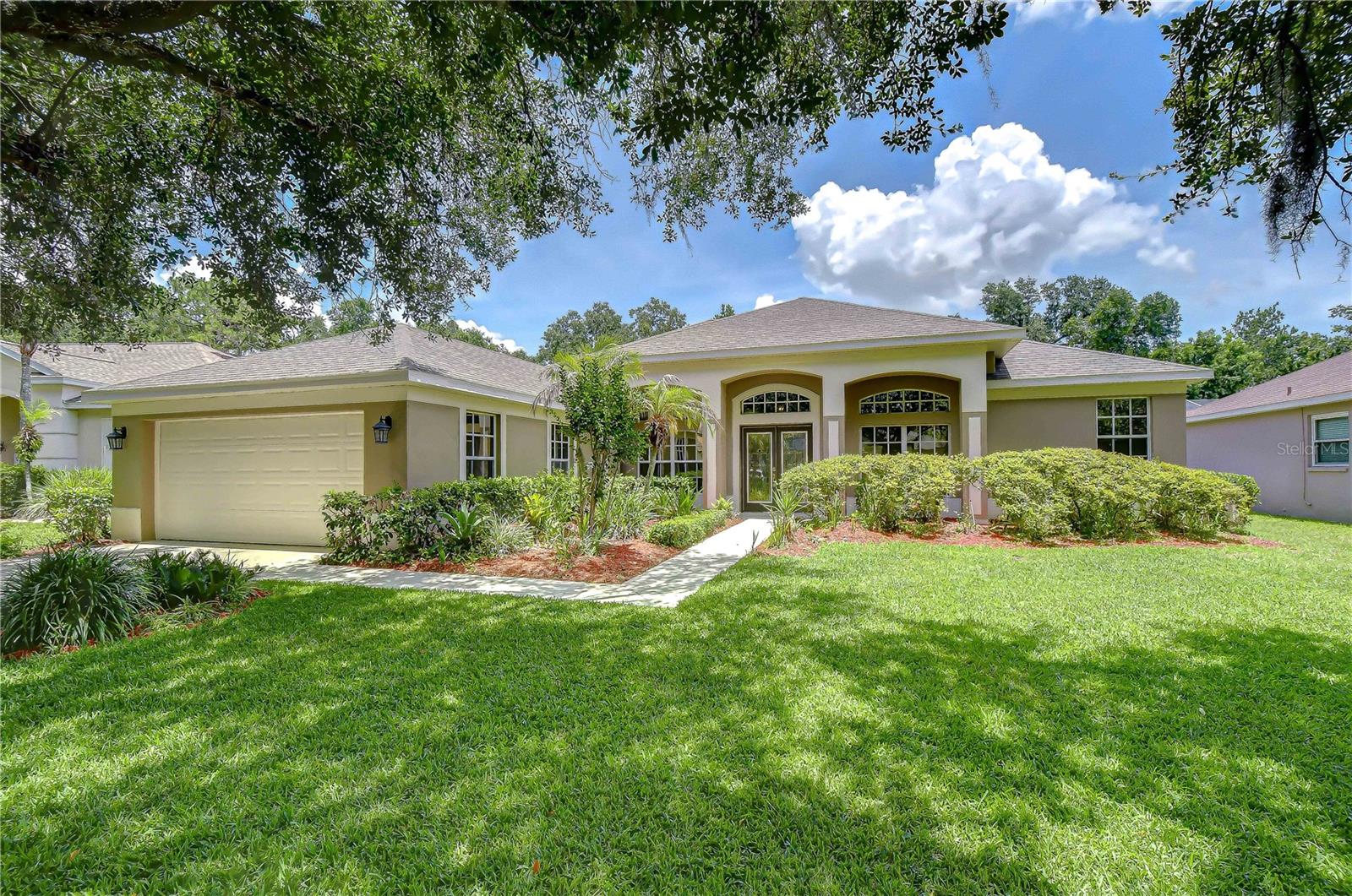 Nestled on a premium Creekside lot in the highly sought-after gated community of River Hills Country Club, this beautiful 4-bedroom, 3-bathroom pool home offers the perfect blend of privacy, comfort, and natural beauty. Surrounded by lush, mature landscaping and backing to a scenic creek and conservation area, this property is a nature enthusiast's dream, providing peaceful views and abundant wildlife right from your own backyard. Thoughtfully maintained and extensively updated, the home features a new roof (2022), pool pump (2025), pool cage replacement (2026), exterior repainting (2026), and multiple windows and doors professionally re-filmed (2026), providing peace of mind for years to come. Step inside to discover a thoughtfully designed floor plan featuring formal living and dining rooms that offer flexible spaces to fit your family's unique needs. At the heart of the home, the spacious family room showcases stunning backyard views through large sliding glass doors and seamlessly connects to the kitchen, creating an ideal gathering space for entertaining and everyday living. The well-appointed kitchen features upgraded granite countertops, an updated center island, stainless steel appliances, abundant cabinetry, and generous counter space, providing plenty of storage and prep space for the home chef. Whether hosting family gatherings or preparing weeknight meals, this functional and inviting space is designed to accommodate it all. The extended primary suite is a true retreat, featuring a private sitting area, direct access to the lanai, two walk-in closets, and an en-suite bath complete with a garden tub and separate shower. The desirable triple-split floor plan offers privacy for everyone, with two secondary bedrooms tucked away at the rear of the home and an additional bedroom situated in its own private wing, making it an ideal guest suite, home office, or multi-generational living space. The true showstopper, however, is the incredible backyard retreat. Surrounded by lush tropical landscaping and mature live fencing that enhances privacy, this fully fenced outdoor oasis offers a peaceful connection to nature. A private gate provides access to the creek beyond, while dedicated garden spaces filled with fruits and vegetables create the perfect setting for gardening enthusiasts. Whether you're relaxing by the sparkling pool, unwinding on the screened lanai, entertaining guests, or simply enjoying the tranquil conservation views and abundant wildlife, this backyard delivers an extraordinary outdoor lifestyle rarely found in River Hills. River Hills Country Club is one of the area's premier communities, offering an 18-hole championship golf course, full practice facility, tennis courts, basketball courts, playgrounds, social events, and more. Residents enjoy the security and exclusivity of two 24-hour manned gates, along with access to top-rated schools. Conveniently located near shopping, dining, and entertainment throughout Brandon and Valrico, with an easy commute to Downtown Tampa and MacDill Air Force Base.