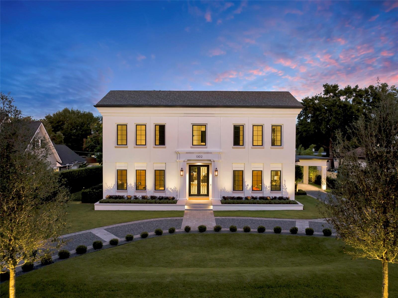 *Under Contract - Accepting Backup Offers* An expression of modern luxury by SMRS Design and Cole Homes, The Maybourne masterfully blends Neoclassical elegance with Art Deco sophistication—all just steps from Winter Park’s iconic Park Avenue.

A curved, manicured driveway leads to a grand entrance featuring bespoke double doors with electromagnetic privacy glass, setting the tone for the artistry within. Inside, a European hotel–inspired foyer greets guests with precast stone-clad walls, inlaid marble flooring, and a Murano-style polyhedral chandelier.

Two first-floor guest suites, each with its own bath, are adorned with rift-cut white oak millwork, curved ceilings, and crystal chandeliers. At the heart of the home lies the main salon, where oak detailing and a deco-style stone fireplace with a holographic insert create an atmosphere of understated grandeur.

The two-tone oak kitchen, wrapped in natural quartzite and anchored by a curved island and custom hood, features a curated suite of professional-grade appliances:
• ILVE range
• Miele refrigerator, freezer, and dishwasher
• Sub-Zero wine and beverage preservation systems

Adjacent, a dining area glows under a custom chandelier, while the powder bath impresses with wood and marble accents, an integrated stone sink, and a Saint Louis crystal faucet by Kallista.

A scullery expands the culinary capability with a chef’s sink, Samsung Bespoke laundry and refrigeration, Wolf microwave drawer, and additional Miele dishwasher—ideal for both entertaining and daily ease.

The first floor primary suite, discreetly hidden behind millwork, offers a serene retreat with an opulent closet system and a marble mosaic-clad bathing suite featuring Kohler digital shower technology and MTI tub.

Upstairs, two additional ensuite bedrooms, a bonus room with walk-in closet, and a secondary laundry continue the home’s standard of refined luxury.

Outdoors, the residence embraces resort-style living with a natural gas summer kitchen, infinity-edge pool, and 360-degree raised glass-tile spa. A two-car garage and porte cochere, both EV-ready, provide elegant utility.

Modern conveniences include Lutron HomeWorks lighting and shade prewire, built-in SONOS audio zones, pre-installed speakers, and a commercial-grade Ubiquiti WiFi network ensuring flawless connectivity throughout.

A feast for the senses, The Maybourne is more than a home—it’s a statement of artistry and craftsmanship, conceived for the most discerning Winter Park resident.