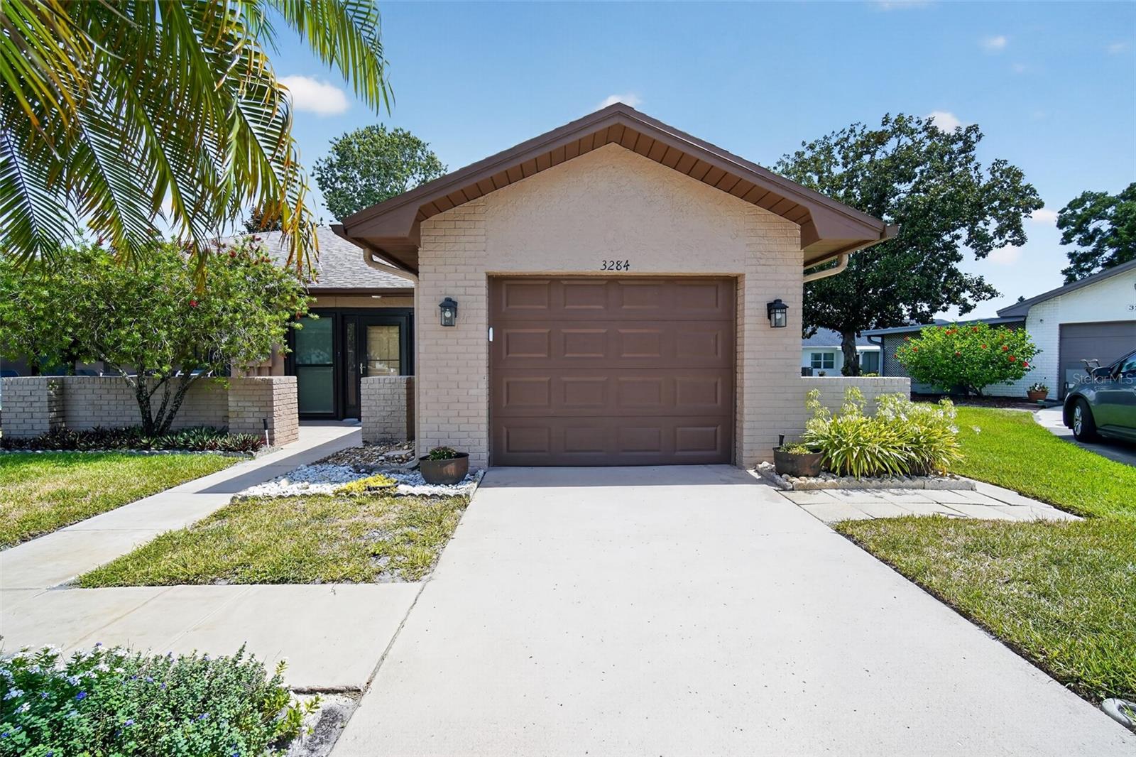 Experience resort-style living in this beautifully maintained 2-bedroom, 2-bathroom villa located at 3284 Gorse Court in Highland Lakes, Palm Harbor's premier 55+ community. Offering 1,148 square feet of thoughtfully designed living space, this home combines comfort, convenience, energy efficiency, and an unmatched amenity-rich lifestyle. Inside, you'll find a bright and inviting open floor plan featuring modern updates throughout, including luxury vinyl flooring, solid surface countertops, and attractive wood cabinetry. The spacious bedrooms offer generous closet space, while the enclosed Florida room, complete with its own A/C vent, provides the perfect year-round retreat for relaxing, entertaining, or pursuing hobbies. This exceptional home is loaded with valuable upgrades, including a whole-home water filtration system, hurricane-impact windows and a hurricane-impact front door, and an owned solar energy system with battery backup. Designed for both efficiency and peace of mind, the solar system powers six essential household circuits during power outages, while delivering remarkably low utility costs, with the owners averaging just $65 per month in electric expenses over the past 12 months. Additional peace of mind comes from the home's high elevation—no flood insurance required. As a resident of Highland Lakes, you'll enjoy access to one of Tampa Bay's most active and desirable 55+ communities. Amenities include unlimited free golf on three private executive courses, heated pools, a whirlpool spa, tennis courts, pickleball, bocce ball, and a vibrant clubhouse offering year-round social events, clubs, workshops, and performing arts programs. For boating and fishing enthusiasts, the exclusive Lake Tarpon Lodge features a private boat ramp, fishing pier, community pontoon boats, and even transportation to waterfront restaurants. Residents also benefit from free secure storage for RVs and boats. Whether you're seeking an active lifestyle, low-maintenance living, exceptional energy savings, or a welcoming community atmosphere, this outstanding villa offers the perfect opportunity to enjoy the very best of Florida living.