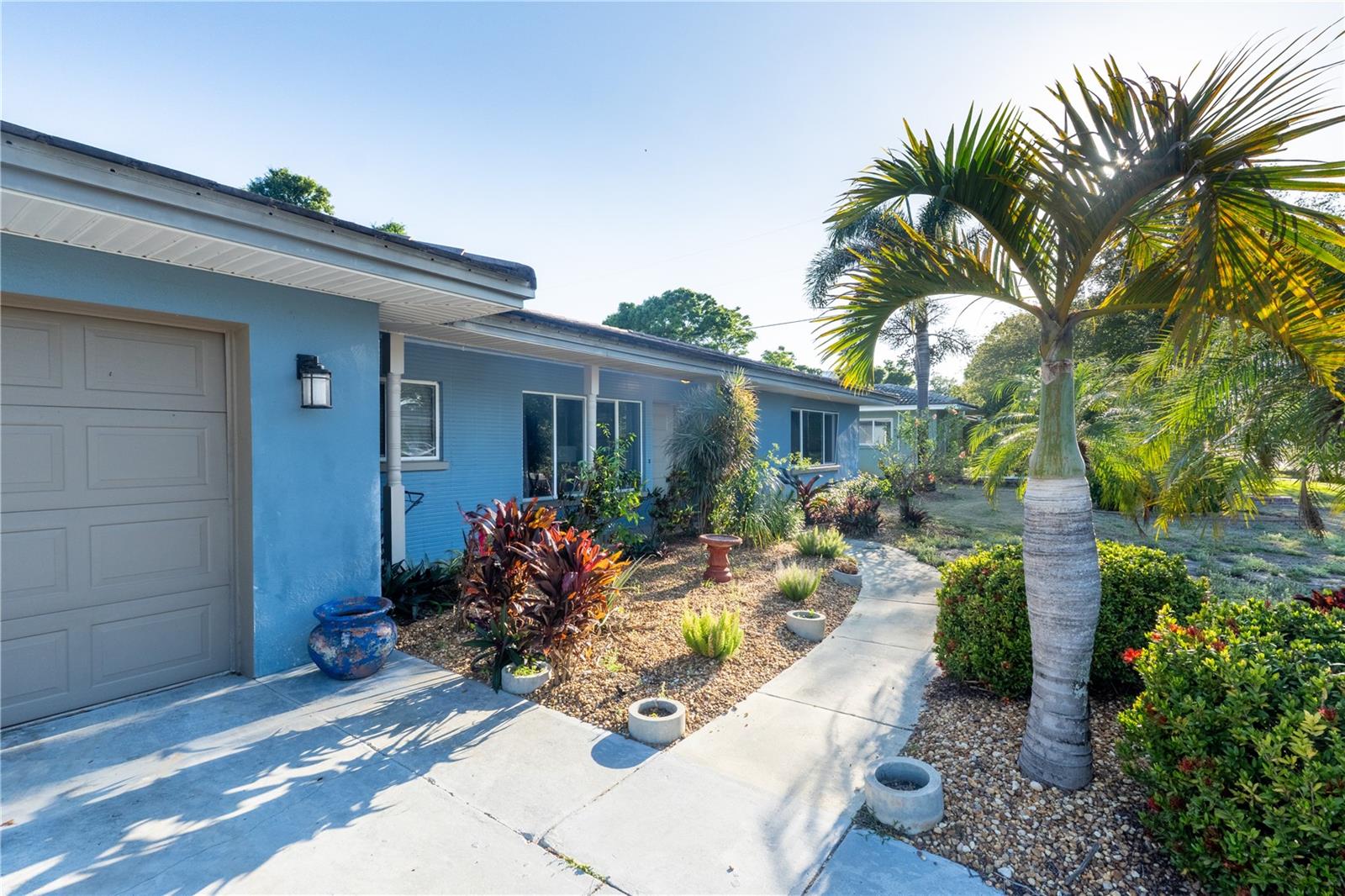 Welcome to your own slice of paradise in Belleair Bluffs. Situated on a quiet residential street just minutes from the Gulf beaches, this beautifully maintained 3-bedroom, 2-bath pool home combines timeless Florida charm with comfortable modern living.

Inside, you’ll find approximately 1,750 square feet of thoughtfully designed living space featuring an open-concept layout that effortlessly connects the living room, family room, and kitchen. Natural light fills the home, while a cozy fireplace creates a warm and inviting focal point perfect for relaxing evenings or entertaining guests.

The heart of the home is the seamless indoor-outdoor living experience. A dramatic three-panel sliding glass door opens fully to the covered lanai, extending your living space outdoors and creating the ideal setting for year-round Florida living. Beyond the lanai, a screened enclosure surrounds the solar-heated, kidney-shaped in-ground concrete pool, allowing you to enjoy comfortable swimming throughout the seasons while maximizing energy efficiency.

Set on an expansive 9,030-square-foot lot, the backyard is a true private retreat. Mature citrus trees add beauty and charm while providing fresh fruit right from your own yard, and a dedicated firepit area creates the perfect space for relaxing evenings under the stars with family and friends.

Additional highlights include a durable tile roof, attached garage, mature landscaping, and a location in one of Pinellas County’s most desirable coastal communities. Conveniently located near top-rated dining, boutique shopping, marinas, and the pristine Gulf beaches, this home offers the perfect blend of lifestyle, comfort, and convenience.

Whether you’re looking for a primary residence, seasonal getaway, or investment opportunity, this exceptional property delivers the very best of Belleair Bluffs living.

Private showings available by appointment only. Schedule your tour today and experience this Florida pool home for yourself.