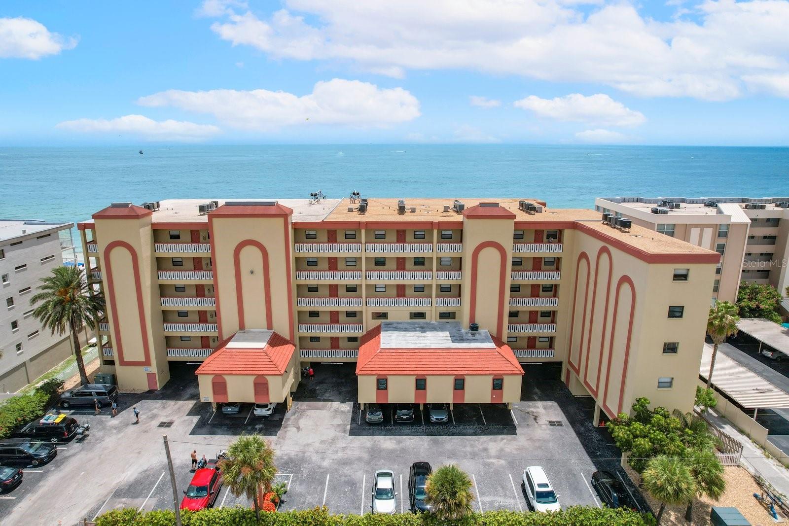 This exceptional income-producing property has consistently generated $75-$80,000 annually in rental revenue, even though the storms impacted the last two years, owner occupancy and already has solid reservations in place for the coming year. 2026 projected rental over $95,000. It offers an outstanding opportunity for both personal enjoyment and investment.
The residence is a beautifully updated, 1,440 sq. ft., turnkey unit on the lower first floor —perfectly positioned to provide the sensation of being right on the sand while benefiting from a secure elevation. Notably, the condo sustained no flood damage during recent storms. Lovingly updated and maintained, the unit shows like new.
Upon entering, you are immediately drawn toward the expansive 25-foot balcony, accessible from both the main living area and the primary bedroom, showcasing stunning panoramic Gulf views. The spacious open-concept living, dining, and kitchen areas feature continuous luxury vinyl flooring that ties the entire unit together. The expansive living room can easily accommodate larger gatherings, creating an inviting space for family and guests to relax. The dining area includes seating for six indoors, with additional dining space along the kitchen bar.
The modern updated kitchen is appointed with wood cabinetry, laminate countertops, and bar seating, stainless steel appliances, and unobstructed water views.
The primary suite is a standout feature, offering a king-size bed, direct living room access and an elegant en-suite bathroom with a granite double vanity, and an updated tub/shower with upscale tile work.
The second en-suite bedroom includes a 2 queen beds, along with a walk-in closet and a beautifully finished bathroom featuring a granite double vanity, tub/shower combination, and a secondary entrance that also serves the third bedroom, which offers a queen bed and ample closet space.
Additional conveniences include a large in-unit laundry room with abundant storage and two dedicated covered parking spaces located directly beneath the unit. A/C and water heater less than two years old. This property includes two deeded covered side by side parking spaces.
The property is ideally situated close to nearby restaurants, shops, and local attractions—making it highly appealing for both owners and vacation renters.