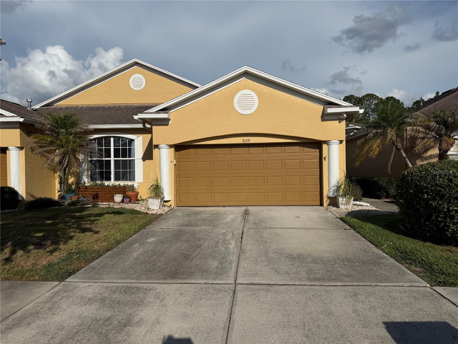 Welcome to Lettingwell Circle in the highly sought-after gated community of Meadow Pointe in Wesley Chapel! Nestled on a picturesque homesite overlooking both water and conservation, this beautifully maintained 3-bedroom, 2-bath villa offers over 2,000 square feet of spacious, low-maintenance living in one of Wesley Chapel's most desirable locations.

The thoughtfully designed open floor plan is ideal for both everyday living and entertaining. At the heart of the home is a gourmet kitchen featuring quality  cabinetry, granite countertops, abundant workspace, and natural gas cooking—a sought-after feature for those who love to cook. Large ceramic tile flooring flows throughout the main living areas, providing both elegance and easy maintenance. The bathrooms have been recently remodeled, offering updated finishes and modern appeal.

Enjoy the convenience of villa living with exterior maintenance handled for you, allowing more time to relax and take in the tranquil water and conservation views from your private outdoor living space.

Families will appreciate access to highly rated schools, including Wiregrass Elementary School, John Long Middle School, and Wiregrass Ranch High School. Meadow Pointe residents enjoy an impressive array of amenities, including a resort-style pool, clubhouse, tennis courts, basketball courts, playgrounds, and walking trails, creating an active and engaging lifestyle.