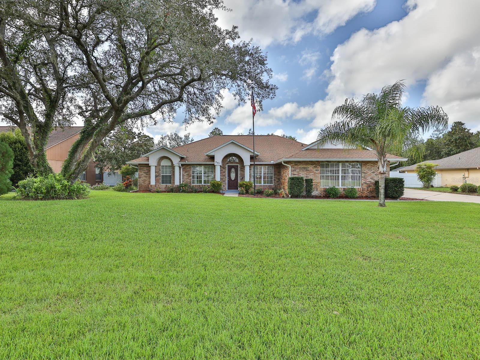 POOL HOME IN ONE OF DEBARY'S MOST POPULAR GOLF COMMUNITIES, GLEN ABBEY.  This lovely home has been well cared for and features an open floor plan with 3 bedrooms, 2 baths, formal living room, formal dining room, spacious kitchen, breakfast area and large great room/family room.  The remodeled kitchen offers lots of cabinet space ~ breakfast bar ~ granite countertops ~ stainless steel appliances.  The master bathroom was completely remodeled with his and her vanities and a nice size walk-in shower.  Other home features are high vaulted ceilings, planter shelves, built-in surround sound in the living room (extends to the patio too) and a split bedroom plan. 
Many upgrades made throughout the home to include the remodeled kitchen and both baths, flooring (bedrooms, living room & dining room), fans & light fixtures, added recessed lighting in the kitchen & family room, replaced the sliding glass doors, new interior paint, Bosch A/C system (6.5 yrs old), new water softener system (6 months old), pool resurfaced (2yrs ago) and converted to saltwater with a new high efficiency pump (both 3 yrs ago), pool enclosure rescreened (4yrs ago), pavers installed in the pool area/patio (2yrs ago), water heater (7yrs old), Generac portable gas generator (runs the whole house), Ring doorbell w/full perimeter security system and shed w/electric (10 yrs. old).  This home sits on an oversized lot just under 1/2 an acre with it's manicured lawn and landscaping.  The sprinkler system was replaced this year and there is a well for the irrigation.  The home's front elevation has a side entry garage plus the extended driveway accommodates plenty of parking.  The huge backyard is completely fenced with vinyl fencing and great for entertaining and having those summer barbeques and pool parties.  Glen Abbey is a beautiful neighborhood with few homes available.