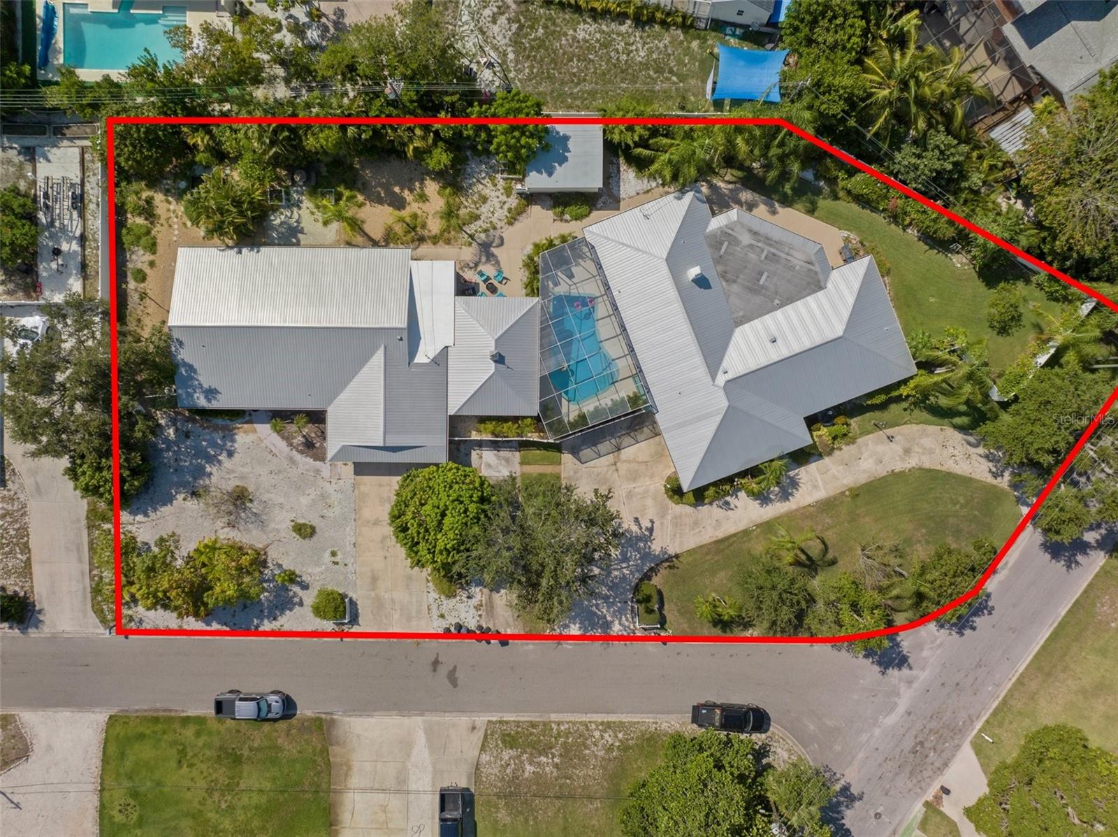 Exceptional Income-Producing Estate & Multi-Generational Compound in NW Bradenton

This remarkable property offers a rare opportunity to own a high-performing income property and/or expansive multi-generational retreat in Northwest Bradenton. Designed to accommodate up to 26 guests, the estate features two separate residences connected by a screened-in, heated pool and outdoor entertainment area, creating an ideal setup for large families, group rentals, corporate retreats, and sports teams attending IMG Academy.

The Main Home boasts 6 bedrooms, 3 full bathrooms, and a spacious chef’s kitchen ideal for entertaining. The Guest Home includes 3 bedrooms, 2 full bathrooms, and a second full kitchen, offering flexibility, privacy, and excellent rental potential.

Ideally located just minutes from Anna Maria Island’s world-class beaches, IMG Academy, and Sarasota-Bradenton International Airport (SRQ), the property delivers strong year-round rental demand at a significantly lower price point than island properties. The area consistently attracts vacationers, athletes, and families from across the country and around the world.

Importantly, the home sits at an elevated 14+ feet, has a metal roof and was unaffected by recent hurricanes, including Helene and Milton—providing added peace of mind, durability, and long-term value.

Additional highlights include:
• 4 garage spaces + 12 driveway parking spaces
• Room for a boat or RV
• No HOA or deed restrictions
• Nearby public boat ramps for convenient water access

Prior Contract Note: The property was previously under contract; however, buyer couldn’t perform - financing fell through. 

Proven Rental Performance:
• 2023 Revenue: $94,980 (Purchased 4/27/23; rentals began 6/30/23)
• 2024 Revenue: $204,879 ($255,478 booked pre-storm)
• 2025 Revenue: $202,987 

This is a rare opportunity to acquire a versatile, high-capacity, and resilient property with documented income and exceptional flexibility.