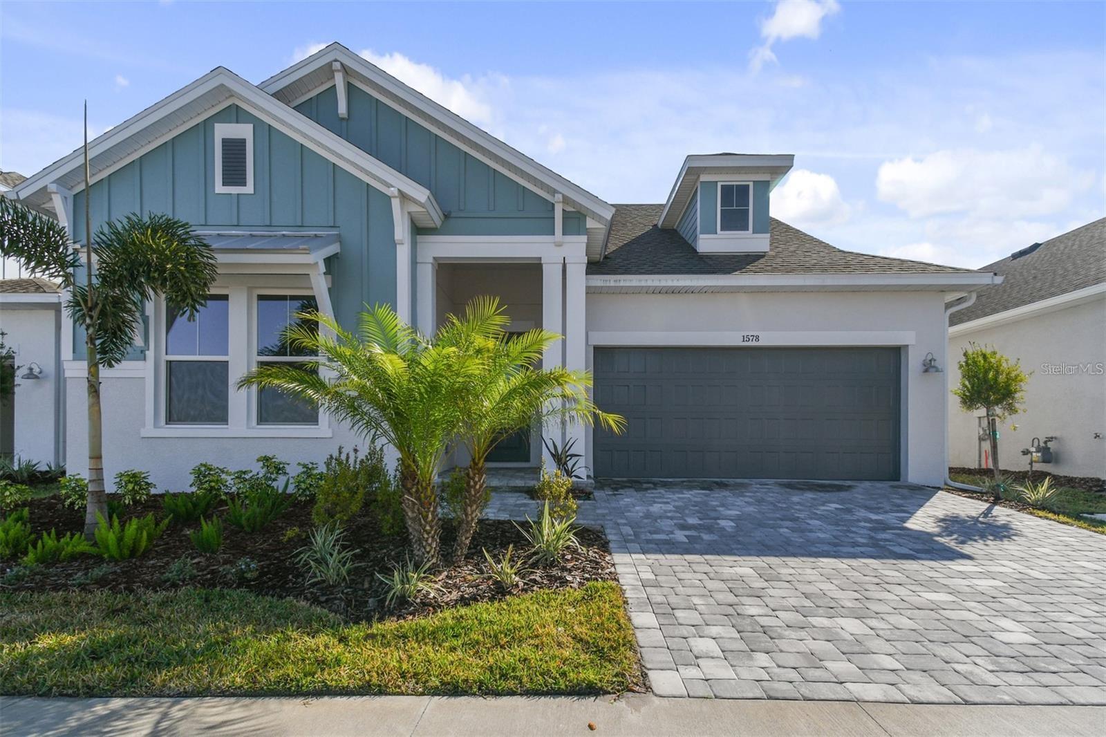 Amazing opportunity… The only one story home available in sought after Emerald Landing at Waterside, Lakewood Ranch. 3 Bedrooms plus Den, like new, just over a year old.  Stylish upgrades and Designer enhancements. Open great room plan with large island for gathering, fabulous kitchen, open dining area.  Inviting Primary suite with spacious closet with built-ins. Screened back porch, paver patio, fenced back yard with gate to walkway to the pool. Impact windows and doors, 3 car garage (tandem). Beautiful location across from the "tree on the lake."  Easy access to the Waterside Village with dining, shopping, Sunday Farmer’s Market and Festival Fun.... David Weekly Homes quality!