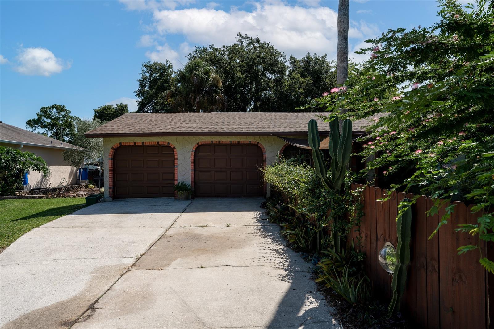 Welcome to your tropical oasis! This concrete block home features 2 bedrooms, 1 bathroom, and 2 single car garages. Just outside the well-appointed kitchen, is a large lanai that leads to your very own paradise. Lush landscaping greets you and makes you feel like you are on your own private island complete with a blueberry bush, lemon tree, orange tree, a pineapple plant, and a koi pond! Need extra storage? There is a large shed outback for all the additional storage you need! Centrally located to get to the beach or the highway in a matter of minutes! Don’t let this opportunity slip away! *all measurements are intended to be accurate but left to the buyer to verify** ;Water: City