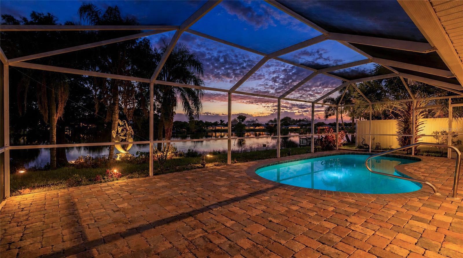 Experience peaceful waterfront living in this 3-bedroom, 2-bath pool home overlooking beautiful Presque Lake. With its special location, expansive lake views, tropical surroundings, and frequent wildlife sightings, this property is truly a rare find.
Designed to make the most of the waterfront setting, four large sliding glass doors open from the main living areas and primary bedroom to the screened lanai and pool. The oversized lanai offers plenty of space for outdoor dining, entertaining, or simply relaxing while taking in the peaceful water views and Southwest Florida sunshine.
Inside, the home features a comfortable layout with separate living spaces and abundant natural light. The kitchen offers generous counter space, a pass-through window to the lanai, and an adjoining breakfast nook overlooking the pool and lake.  Important improvements include a metal roof and overhead garage door installed in 2019, a central air-conditioning system replaced in 2018, and a water heater replaced in 2022.
Enjoy the peaceful atmosphere of lakeside living while remaining close to shopping, restaurants, entertainment, public boat ramps, Downtown Punta Gorda, Fishermen’s Village, Sunseeker Resort, and the beautiful beaches of Englewood and Boca Grande.
Bring your vision and make this rare waterfront pool home your own piece of Southwest Florida paradise.
