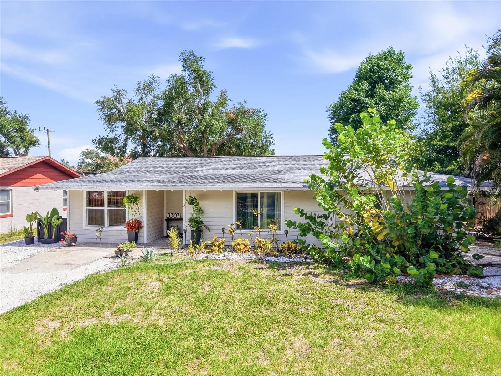 Nestled in one of West Bradenton's most desirable, family-friendly neighborhoods, this charming 3-bedroom home offers the perfect blend of character, comfort, and an unbeatable location. Situated on nearly a quarter-acre in a **NO FLOOD ZONE**, you'll enjoy peace of mind along with plenty of room to create your dream backyard—whether that's a pool, lush tropical landscaping, a garden, or the ultimate entertaining space.
Inside, natural light fills the thoughtfully designed living spaces, creating a warm and inviting atmosphere. The flexible floor plan includes both living and family rooms, offering plenty of space to gather with friends and family or simply unwind at the end of the day. Charming built-in window seats, beautiful wood ceiling accents, ceramic tile flooring throughout, and an updated kitchen with quartz countertops and stainless-steel appliances add timeless appeal while maintaining modern functionality. Recent updates, including a newer roof (2019), electrical panel, air conditioning system, and water heater, make this home truly move-in ready.
Location is what truly sets this property apart. Just steps from Lewis Park, you'll love having playgrounds, pickleball courts, walking paths, and green space right around the corner. St. Stephen's Episcopal School is just minutes away, and you're only a few blocks from the beautiful Manatee River, making evening walks and waterfront sunsets part of your everyday lifestyle. Downtown Bradenton, the Riverwalk, shopping, restaurants, medical facilities, and the white-sand beaches of Anna Maria Island are all just a short drive away.
If you've been searching for a home with charm, a spacious yard, an exceptional neighborhood, and a location that offers the very best of West Bradenton living, this is one you won't want to miss.